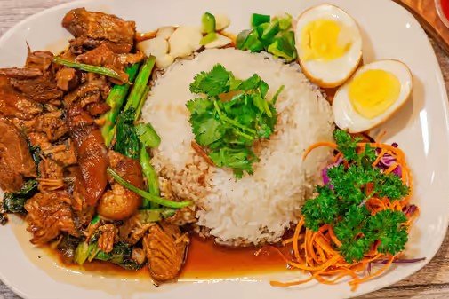 Order Kao Ka Moo food online from Thai Taste Express store, Silver Spring on bringmethat.com