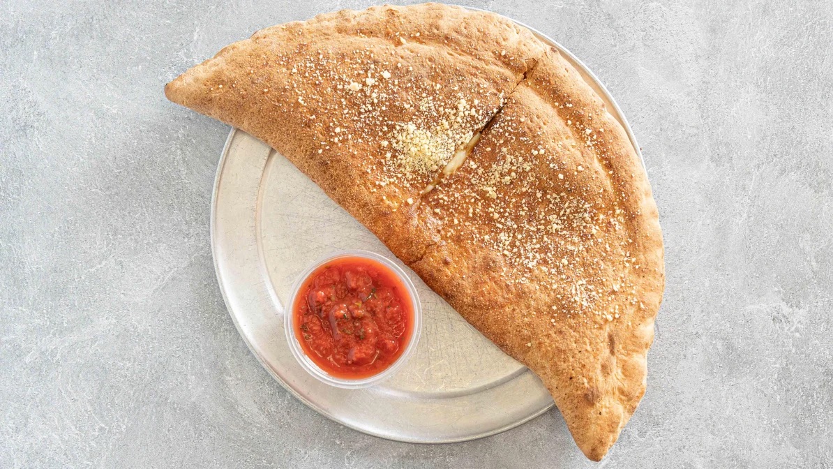 Order Pepperoni and Cheese Calzone food online from Cafe Bambino's store, Pasadena on bringmethat.com