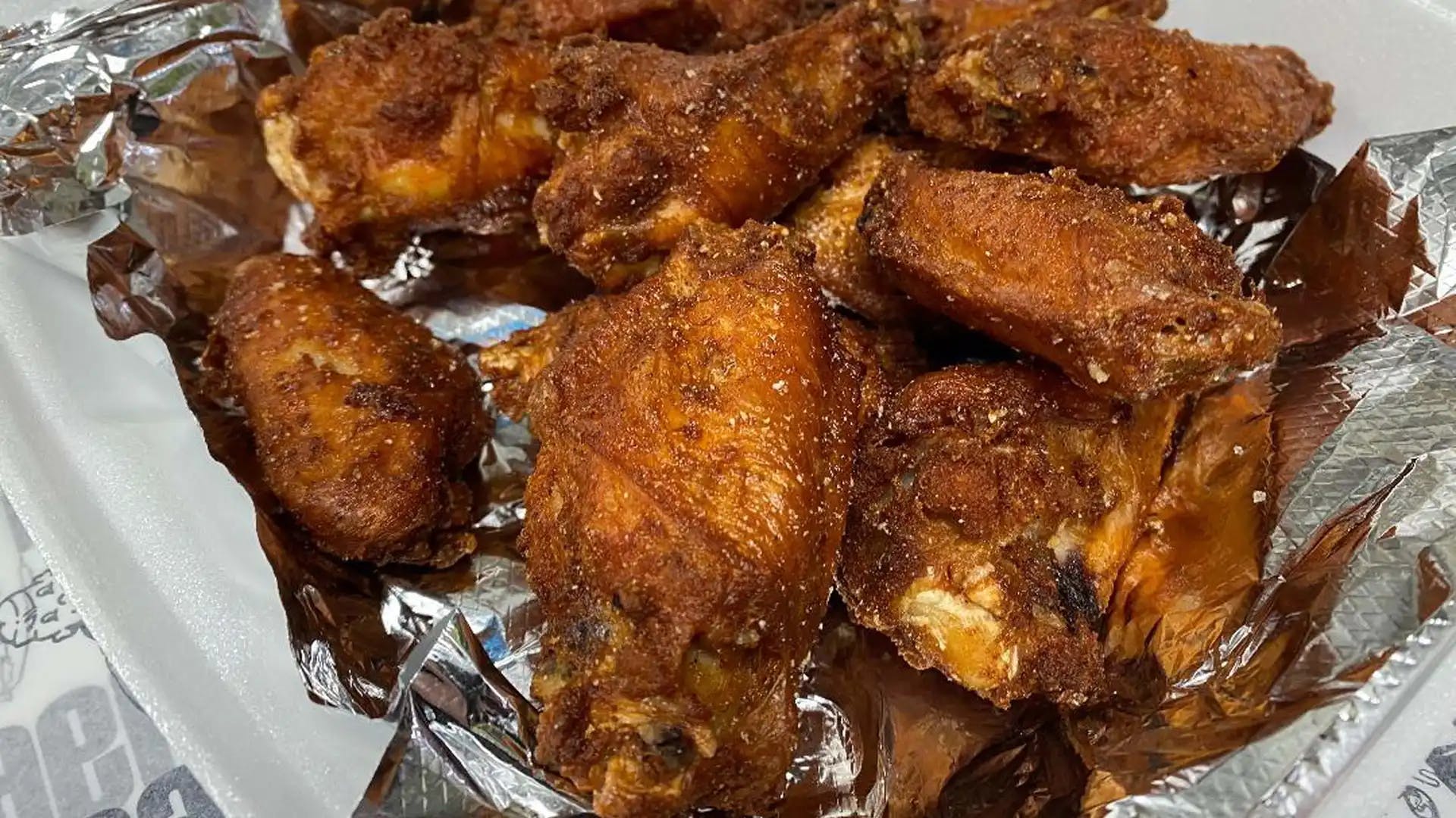 Order Regular Chicken Wings - 1 lb food online from Tubby's Grilled Submarines store, Westland on bringmethat.com