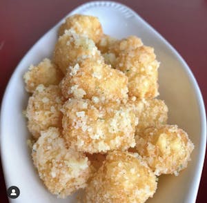 Order Truffle Tater Tots food online from Truffles N Bacon Cafe store, Las Vegas on bringmethat.com