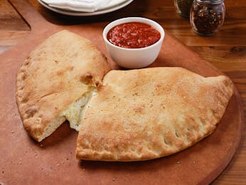 Order Calzone - Medium food online from Select Pizza | Grill store, Cinnaminson on bringmethat.com
