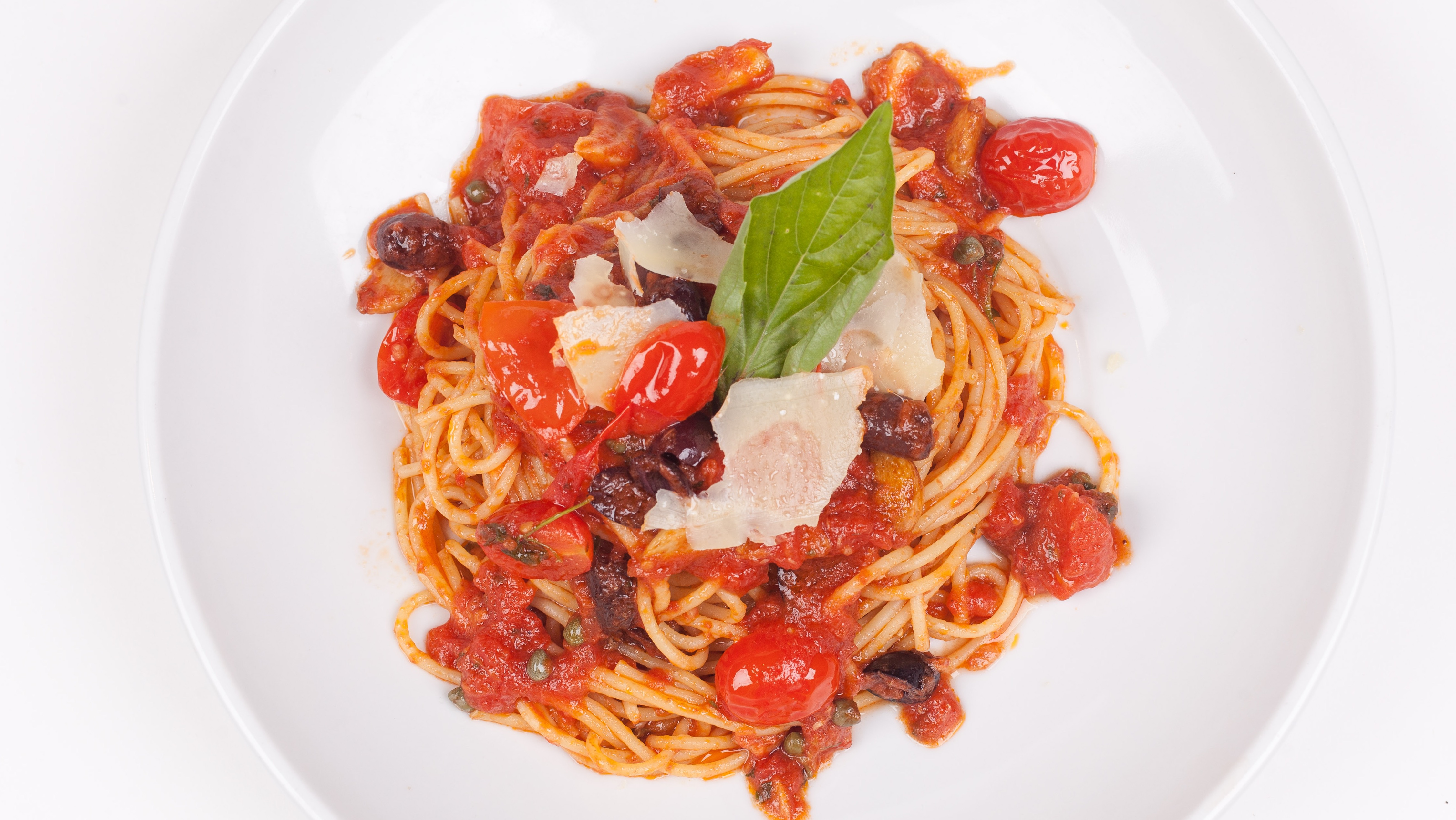 Order Spaghetti Puttanesca food online from Umberto's Pizzeria store, New Hyde Park on bringmethat.com