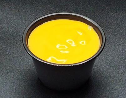 Order Cheddar Cheese Sauce (4oz) # food online from Honey Dress Fried Chicken store, Torrance on bringmethat.com