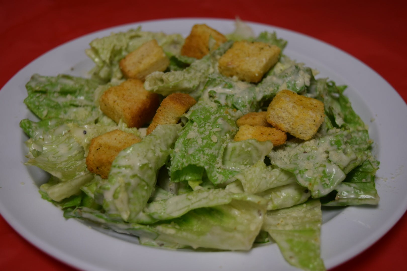 Order Caesar Salad - Small food online from Pizza Parlor store, Pearland on bringmethat.com