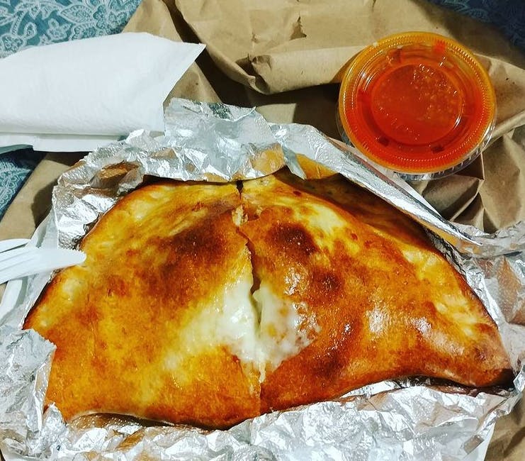 Order Meatball Calzone - Calzone food online from Gabriella's Family Pizza store, Flushing on bringmethat.com