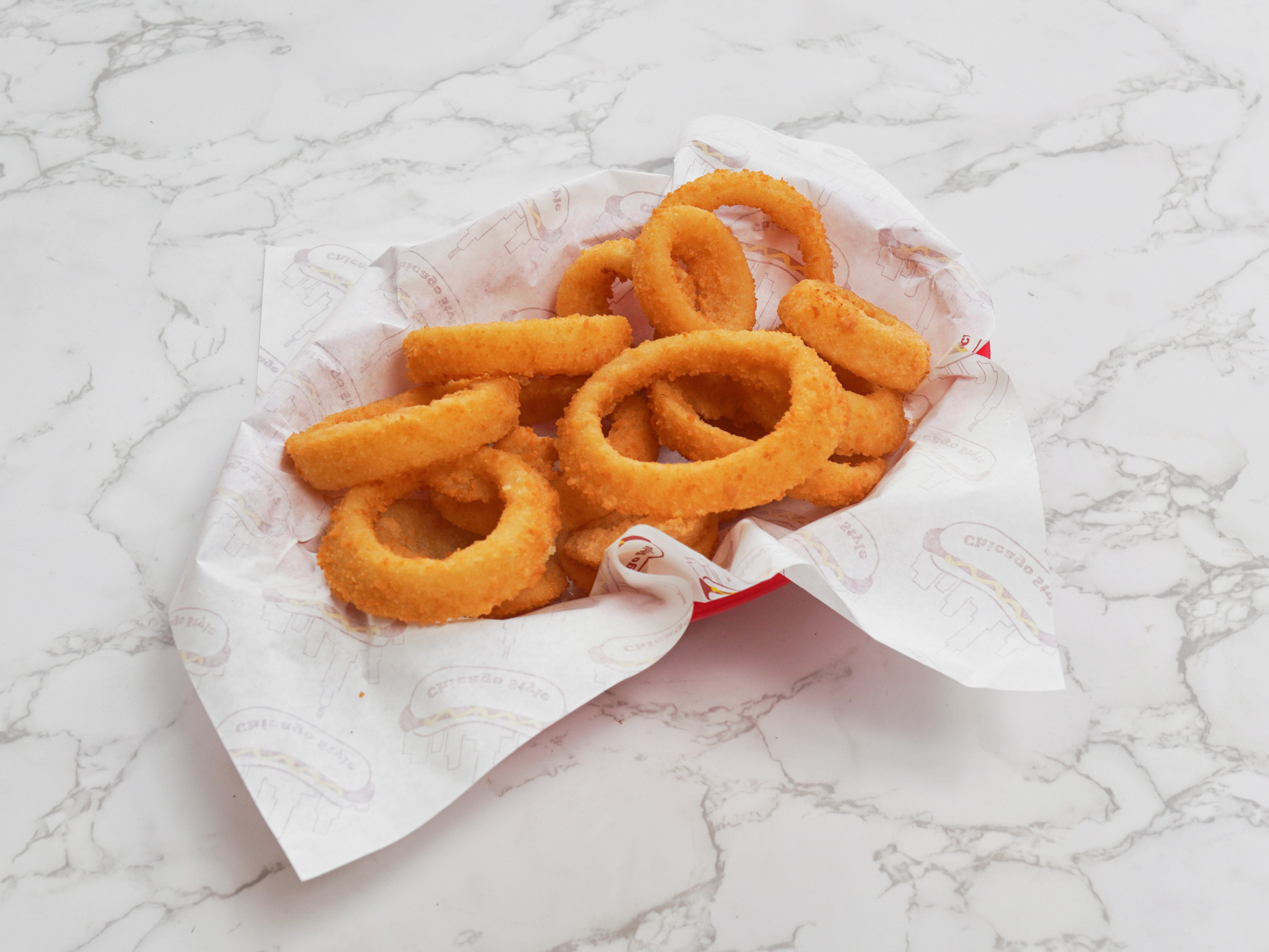 Order Large 1/2 lb. Breaded Onion Rings food online from Eastern Style Pizza store, Chicago on bringmethat.com