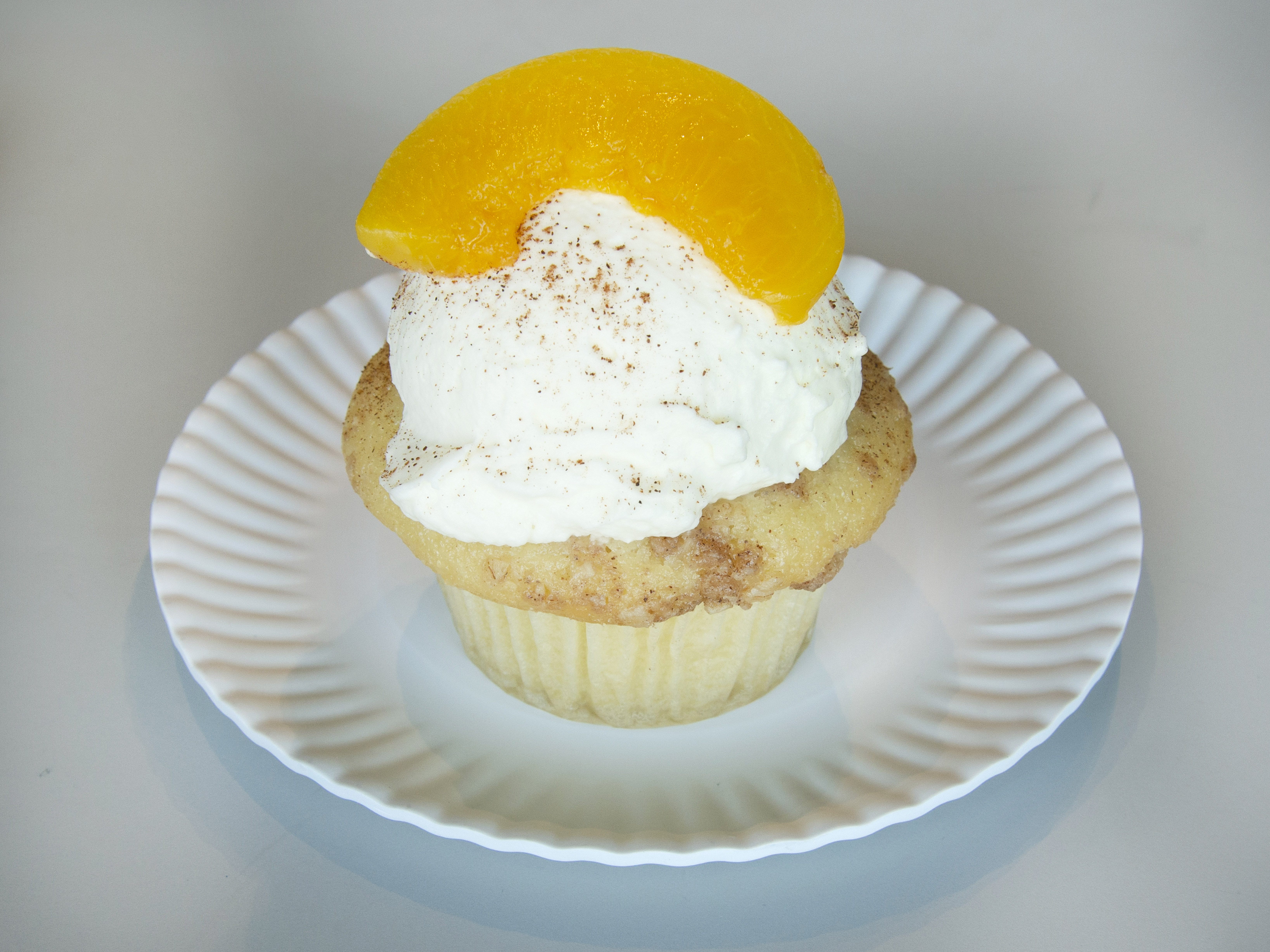 Order Peach Cobbler Cupcake food online from Molly's Cupcakes store, Chicago on bringmethat.com