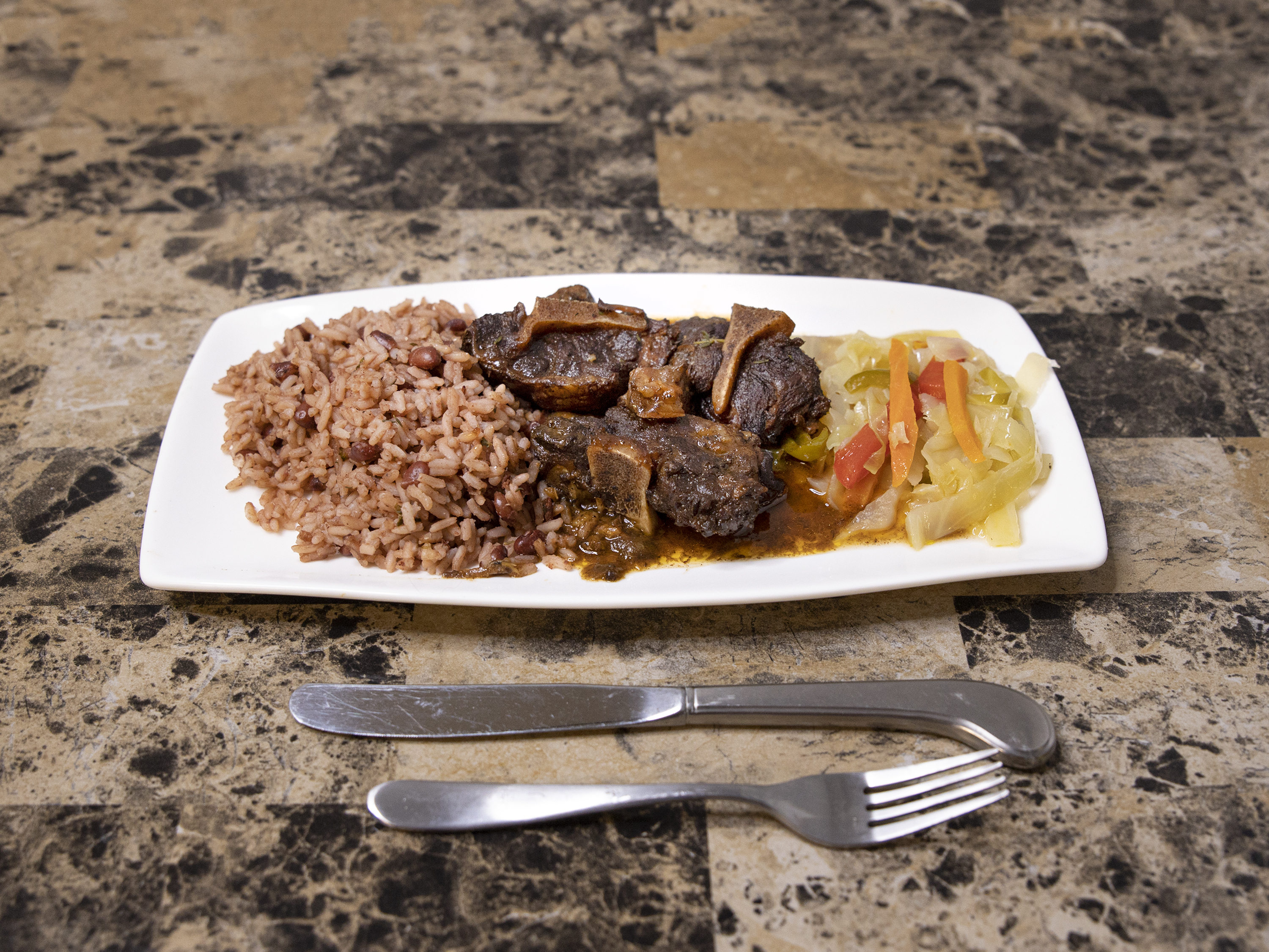 Order Oxtail Dish food online from Negril Caribbean Restaurant store, Wilmington on bringmethat.com
