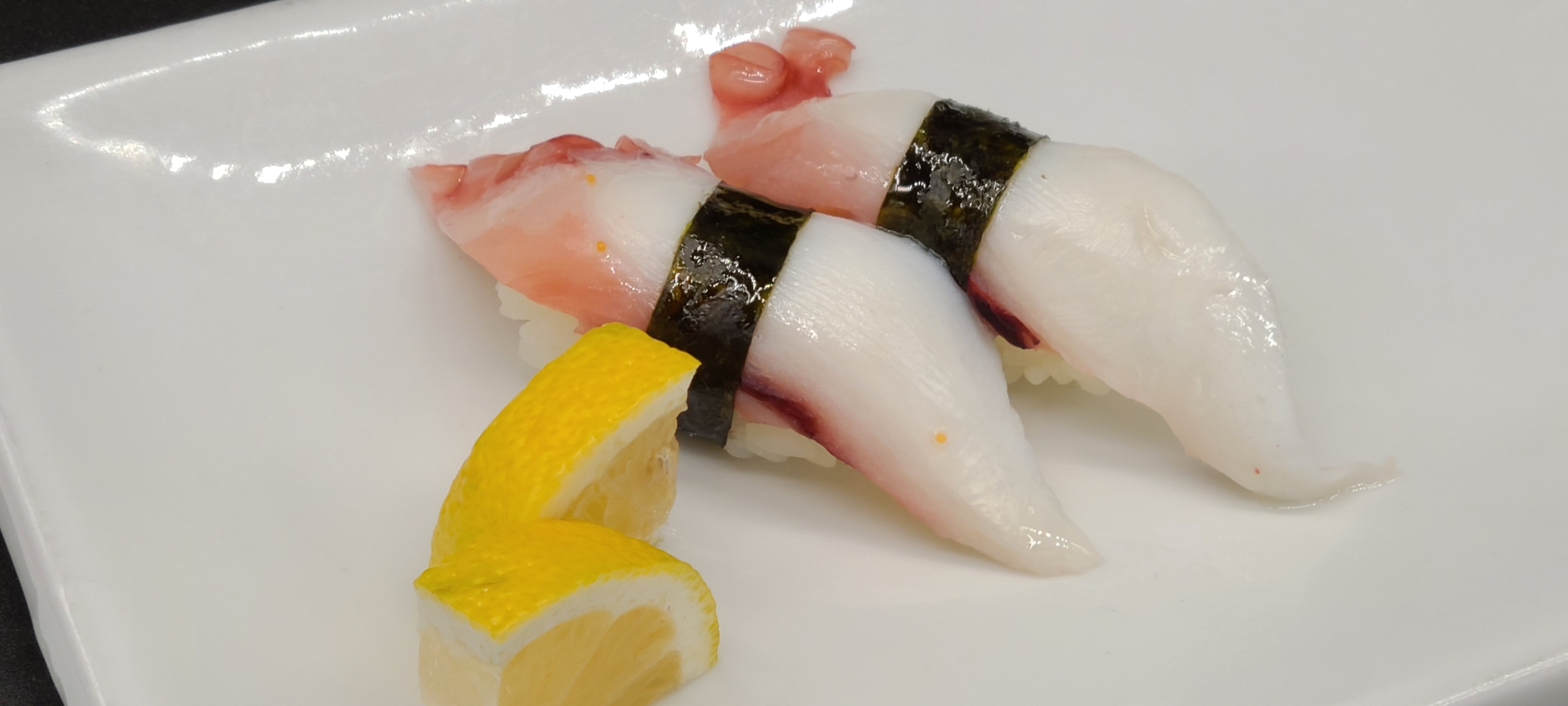 Order N13. Octopus Sushi(2pcs) food online from Hello Sushi store, Fullerton on bringmethat.com