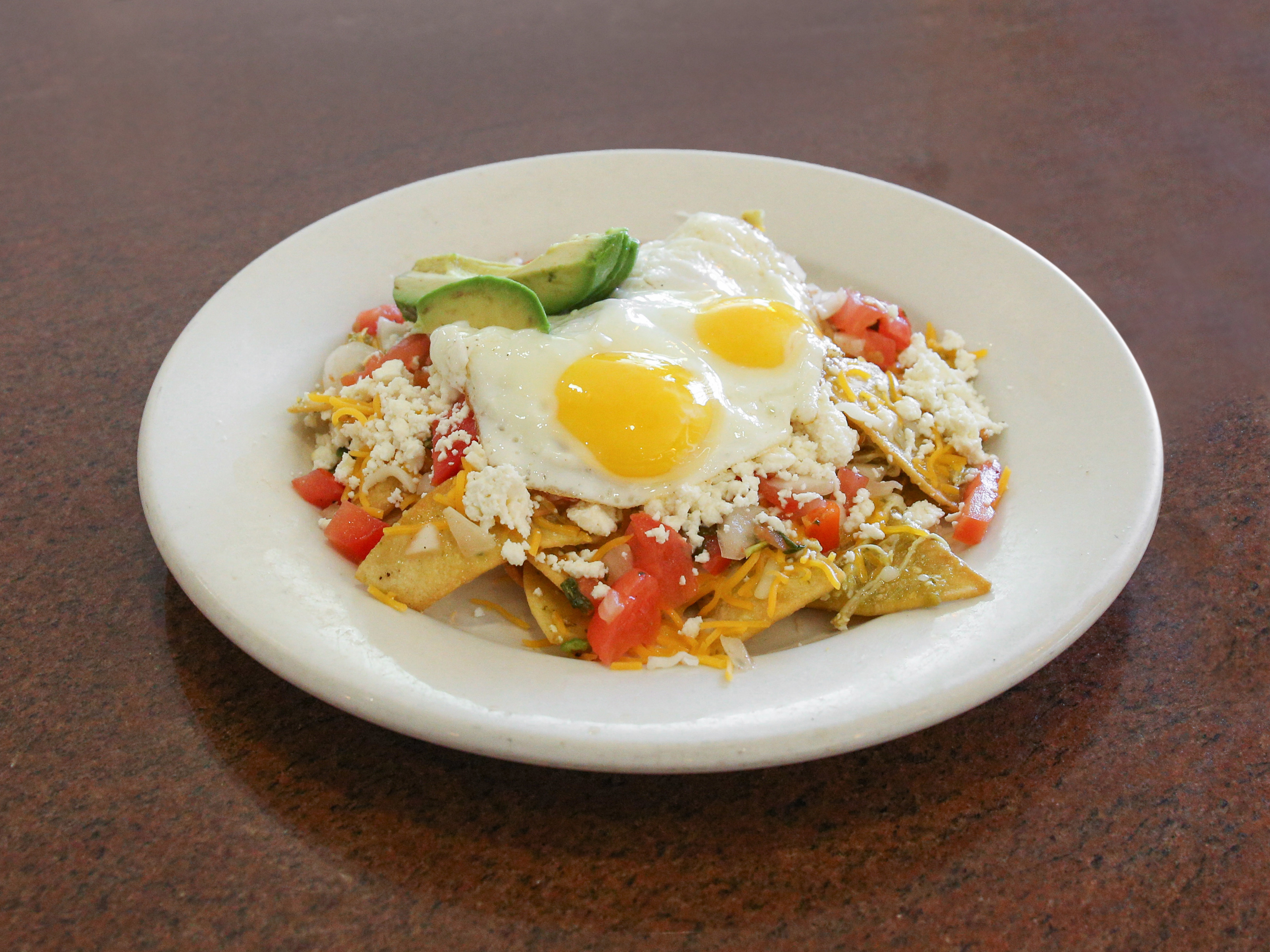 Order Green Chilaquiles Breakfast food online from Norma's Restaurant store, Salinas on bringmethat.com