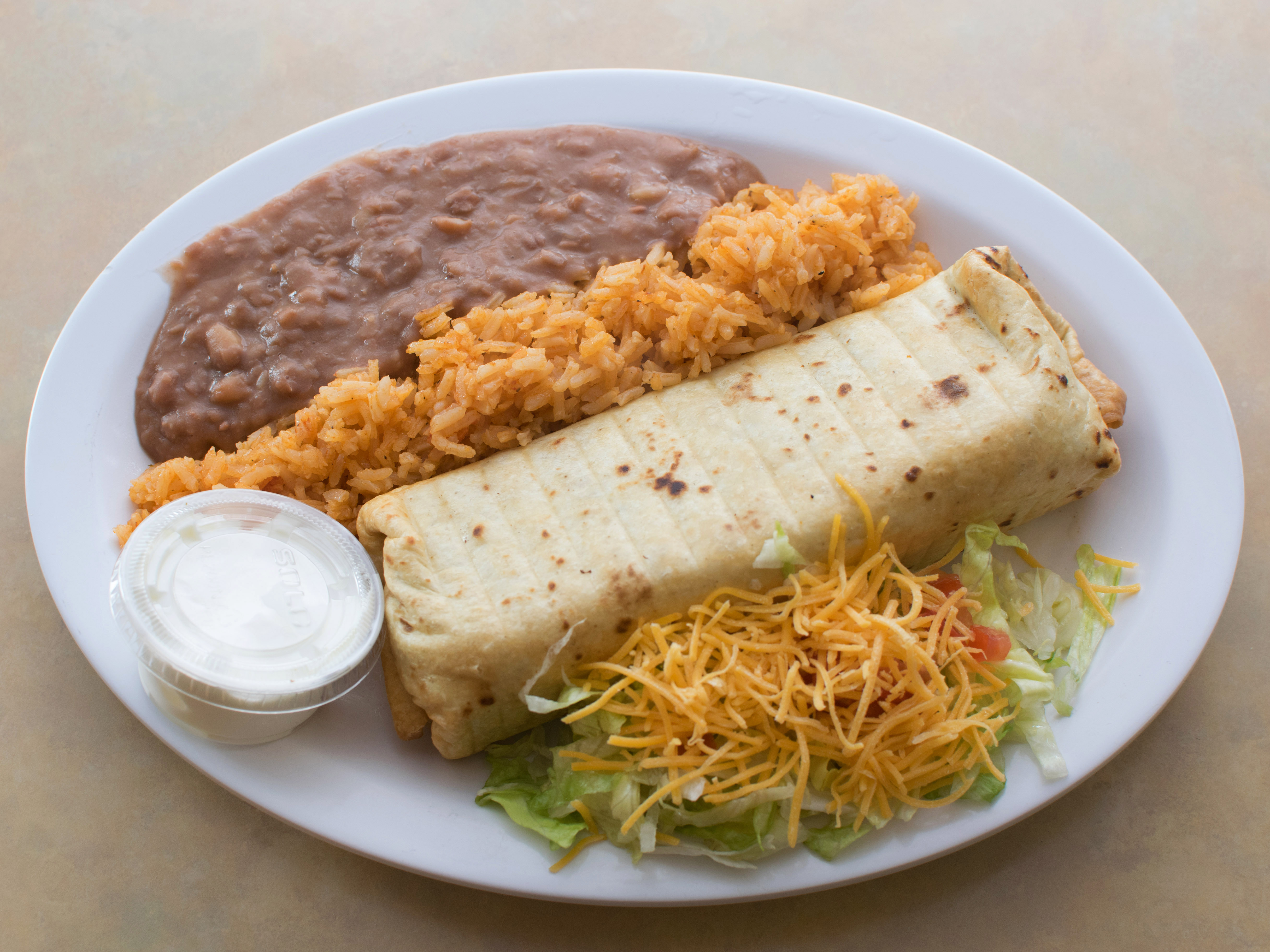 Order Chimichanga Dinner food online from Mexico 2 Go store, Lansing on bringmethat.com