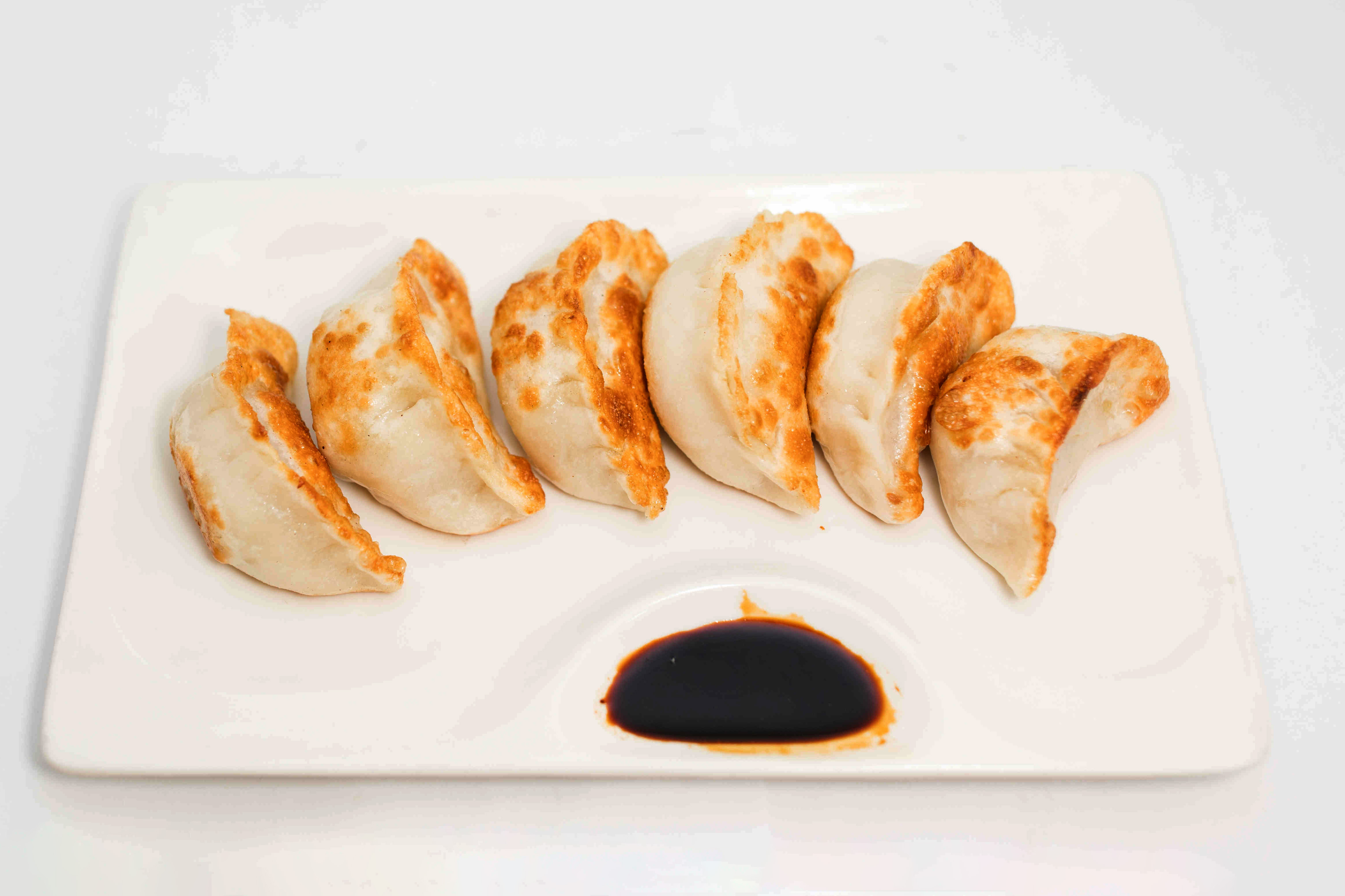 Order Shanghai Pan Fried Dumpling food online from Sichuan hot pot cuisine store, New York on bringmethat.com
