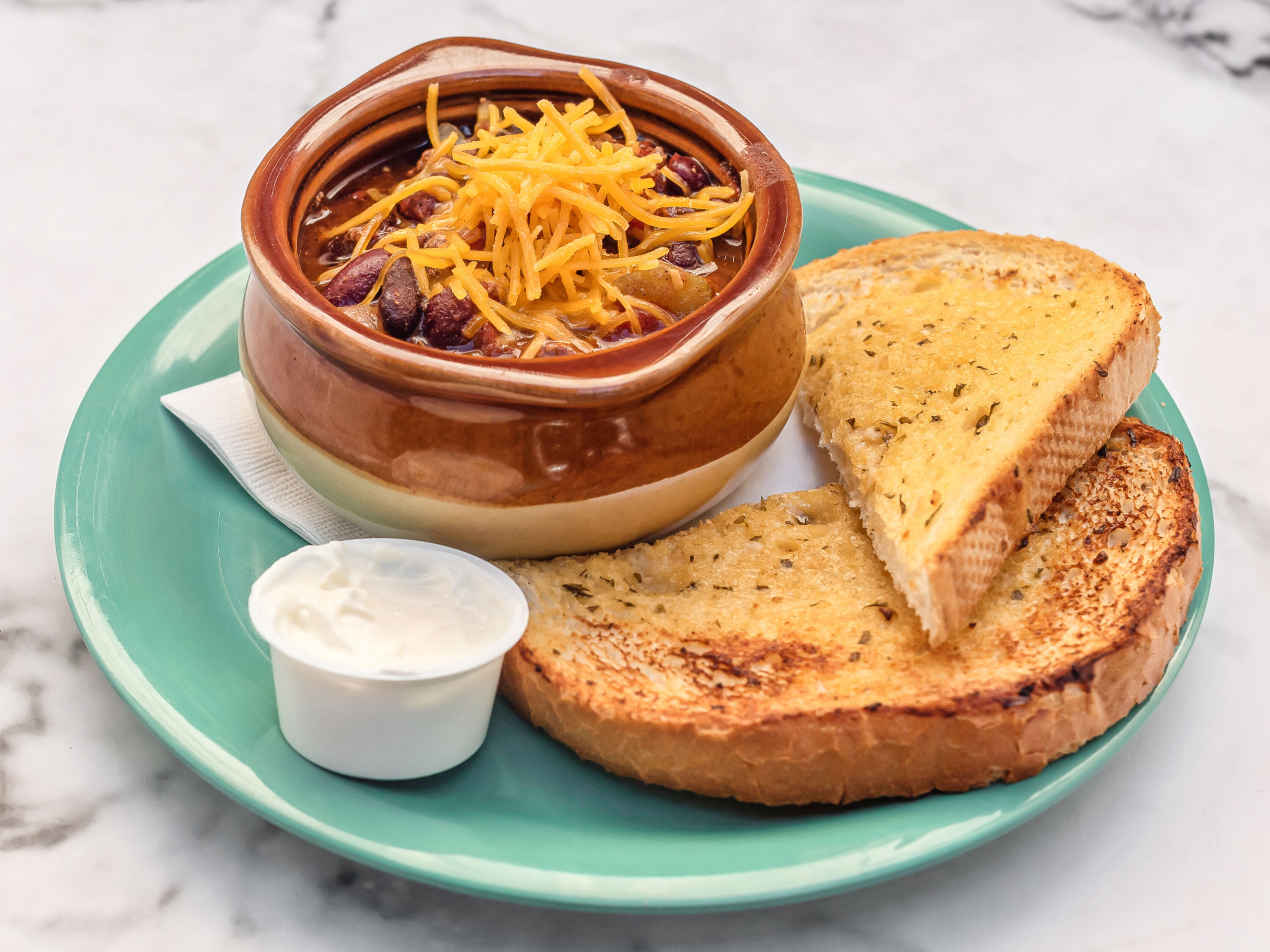 Order Chili con Carne with Cheddar and Sour Cream food online from Riley Pour House store, Carnegie on bringmethat.com