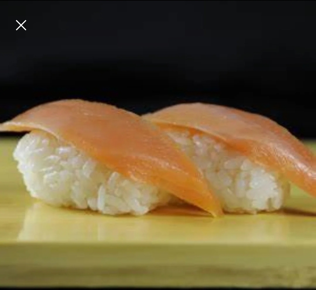 Order Smoked Salmon Sake Nigiri  food online from Taki Japanese Steakhouse store, Atlanta on bringmethat.com