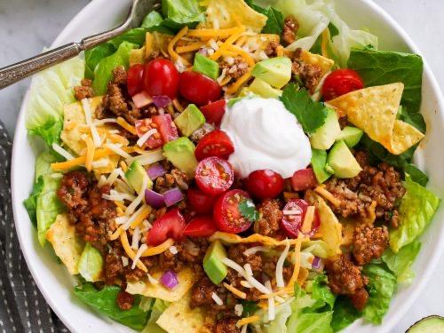 Order Tostada chili salad food online from Board And Cork store, Granbury on bringmethat.com