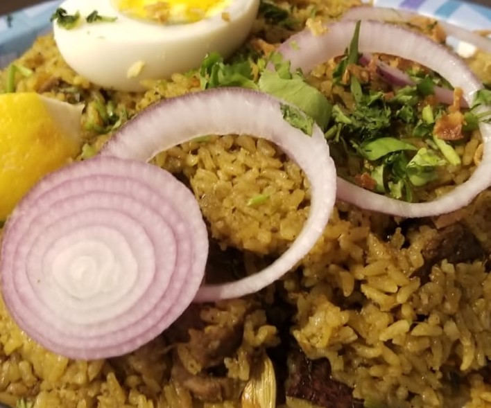 Order Thalappakatti goat biryani food online from Siri Indian Restaurant store, Chicago on bringmethat.com