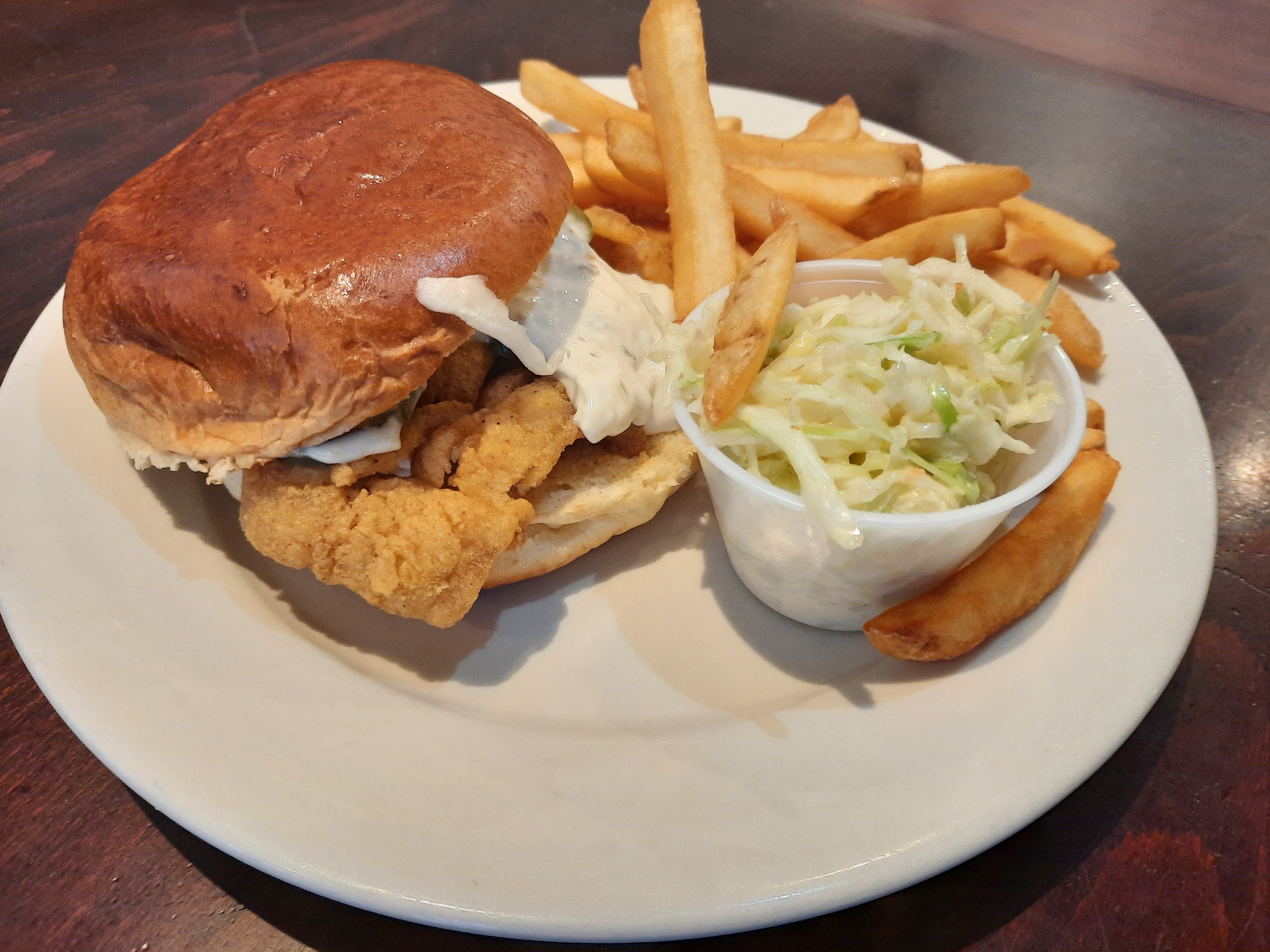 Order Crispy fried Flounder on a brioche bun w coleslaw and french fries food online from Galaxy Diner store, New York on bringmethat.com