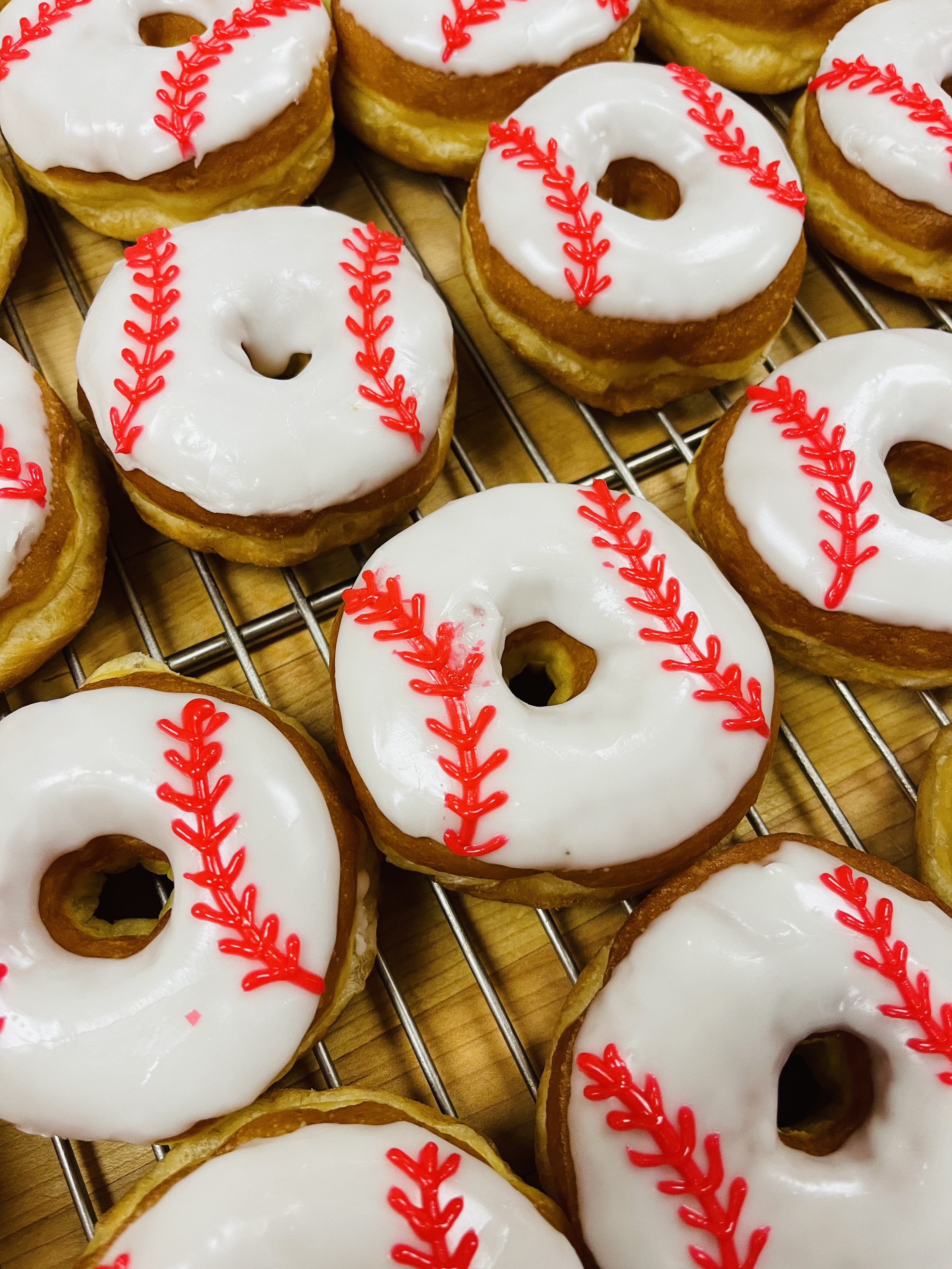 Order One dozen baseball donuts draw  food online from Jc Donuts store, Aliso Viejo on bringmethat.com