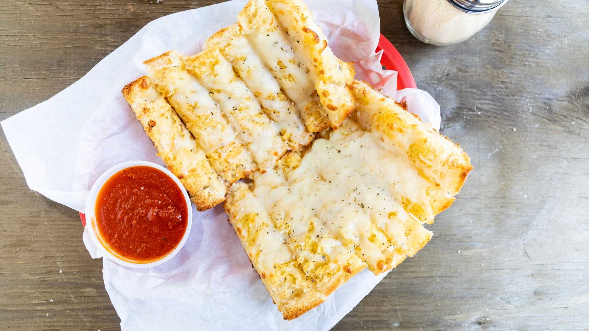 Order Garlic Bread with Cheese - Appetizer food online from Giovannis Pizza store, San Jose on bringmethat.com