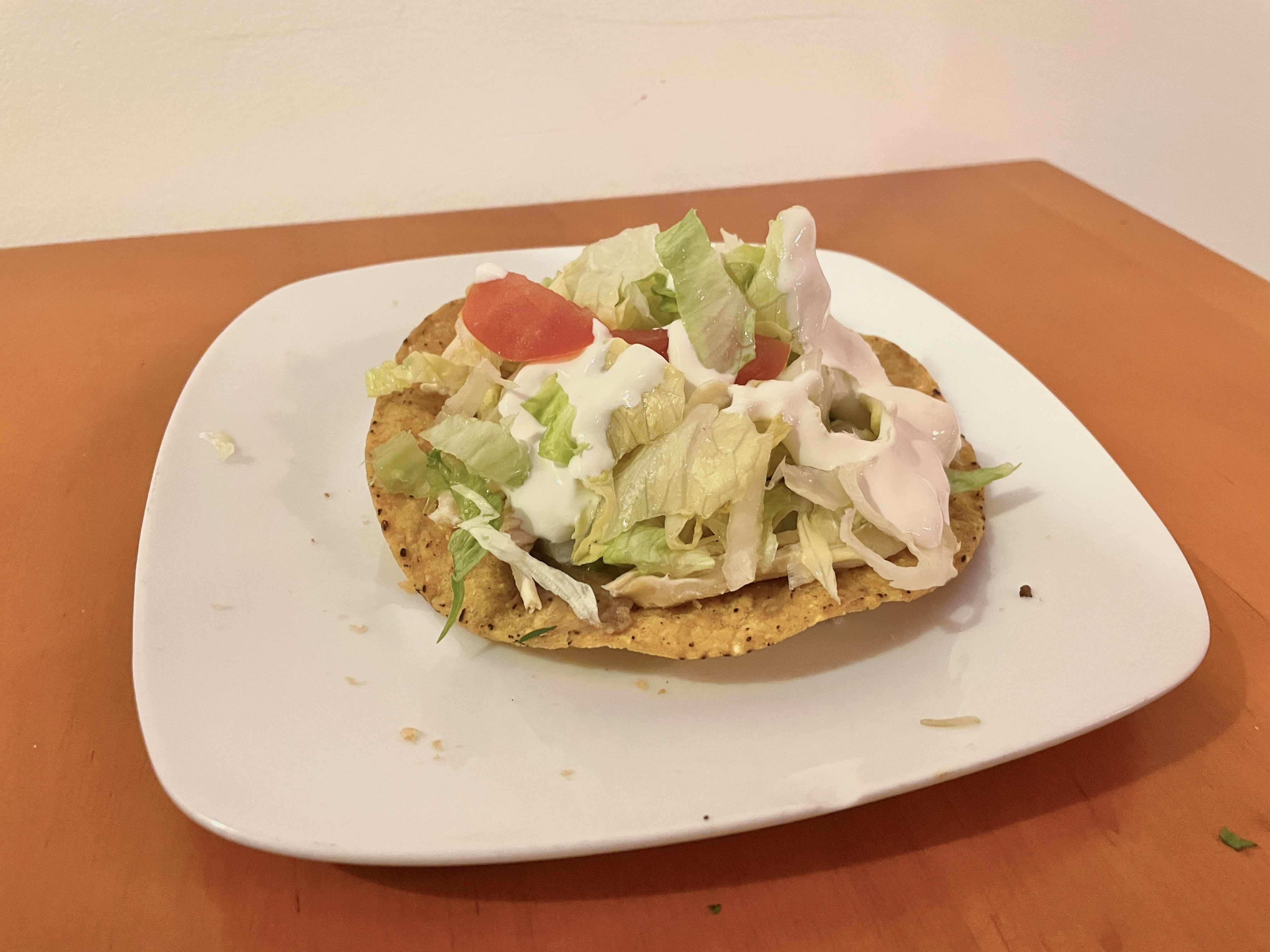 Order Tinga Tostada food online from Chepes Tacos store, Chicago on bringmethat.com