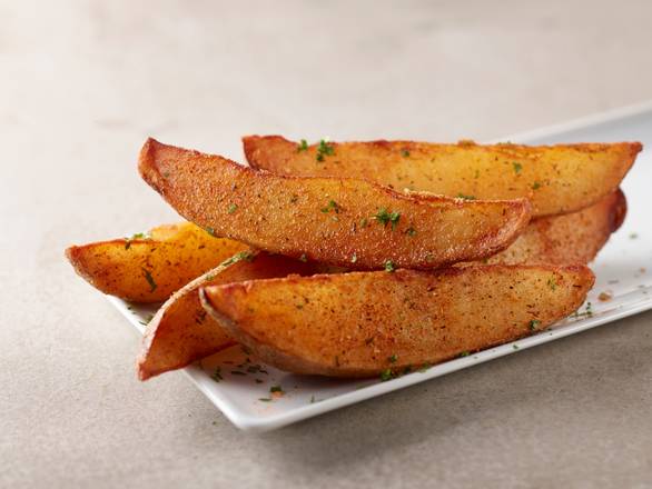 Order Potato Wedges food online from Smokey Bones Barbeque and Grill store, Pittsburgh on bringmethat.com