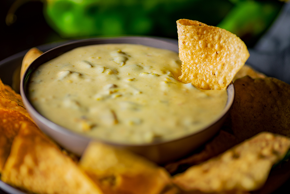 Order Green Chile Queso Dip and Chips food online from Lovecraft store, Phoenix on bringmethat.com