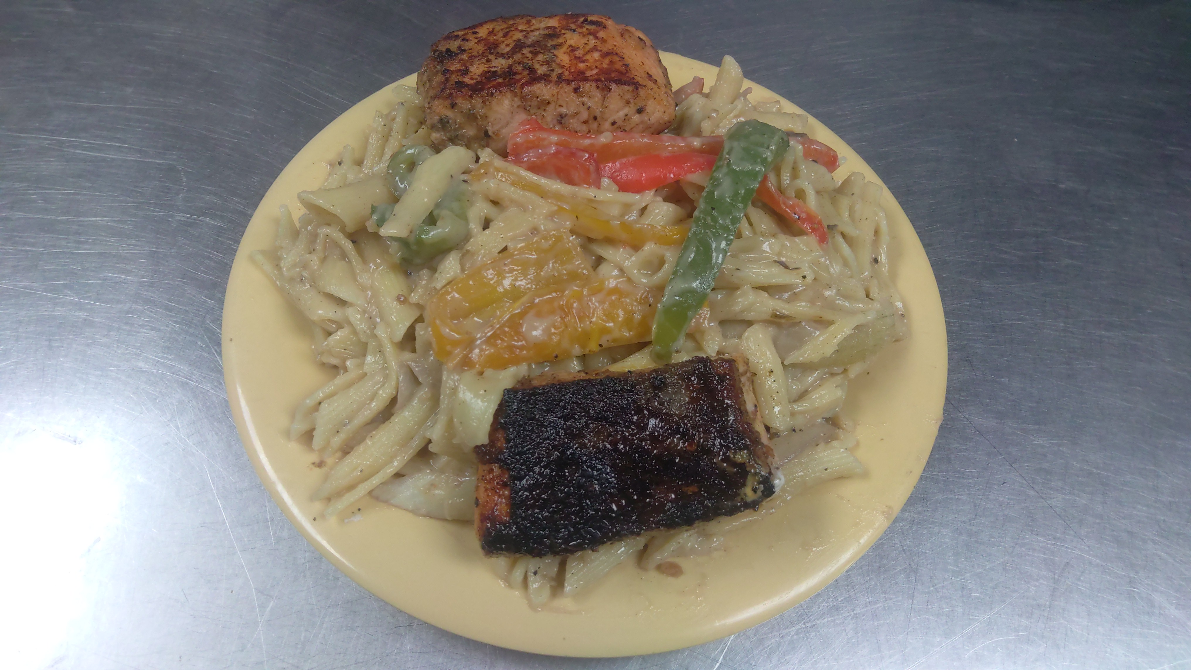 Order 10c. Jerk Salmon Pasta food online from Africana Cuisine store, Perry Hall on bringmethat.com