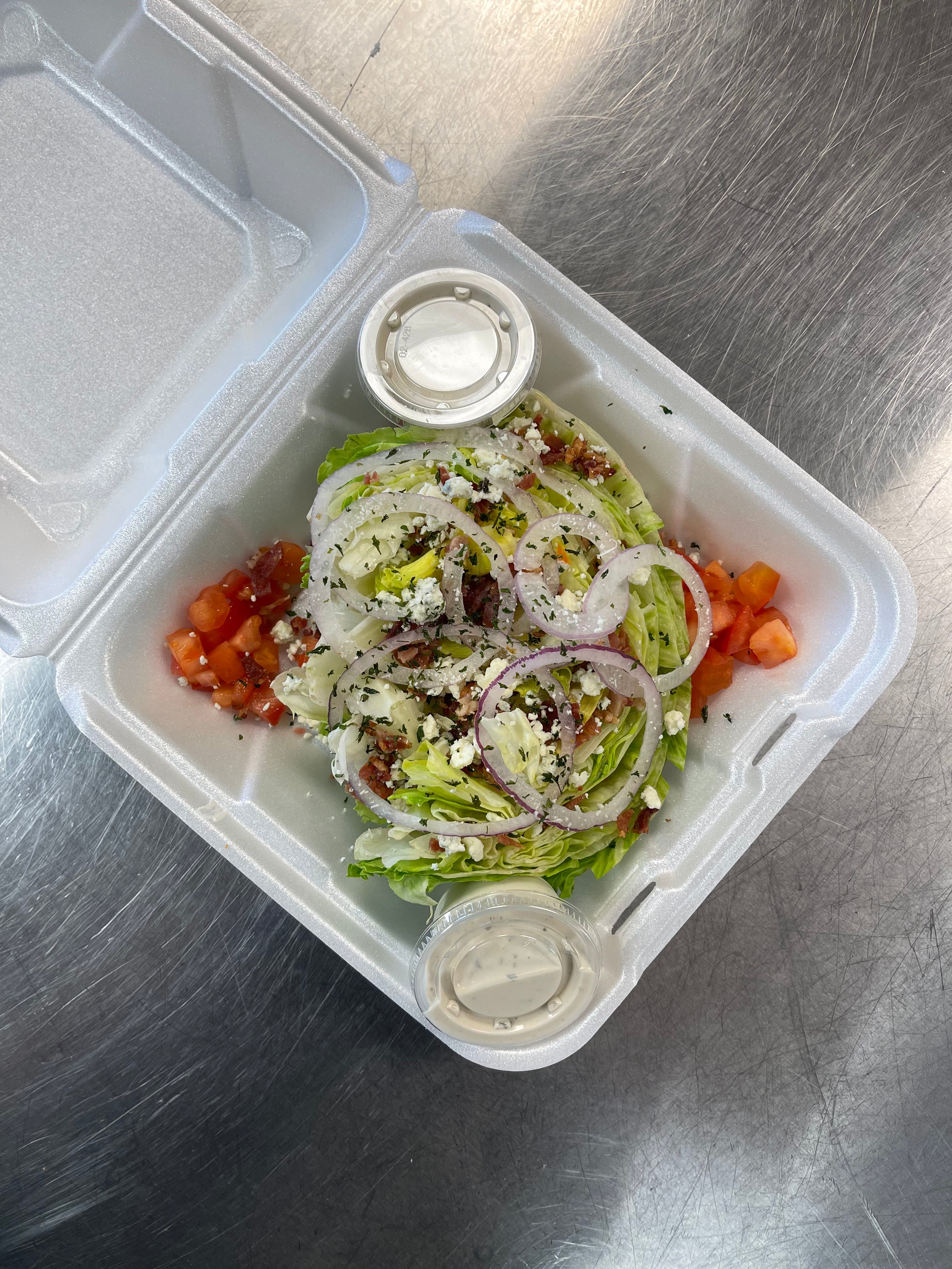Order Bleu Cheese Wedge Salad - Salad food online from Dolce To-Go store, Lake Havasu City on bringmethat.com