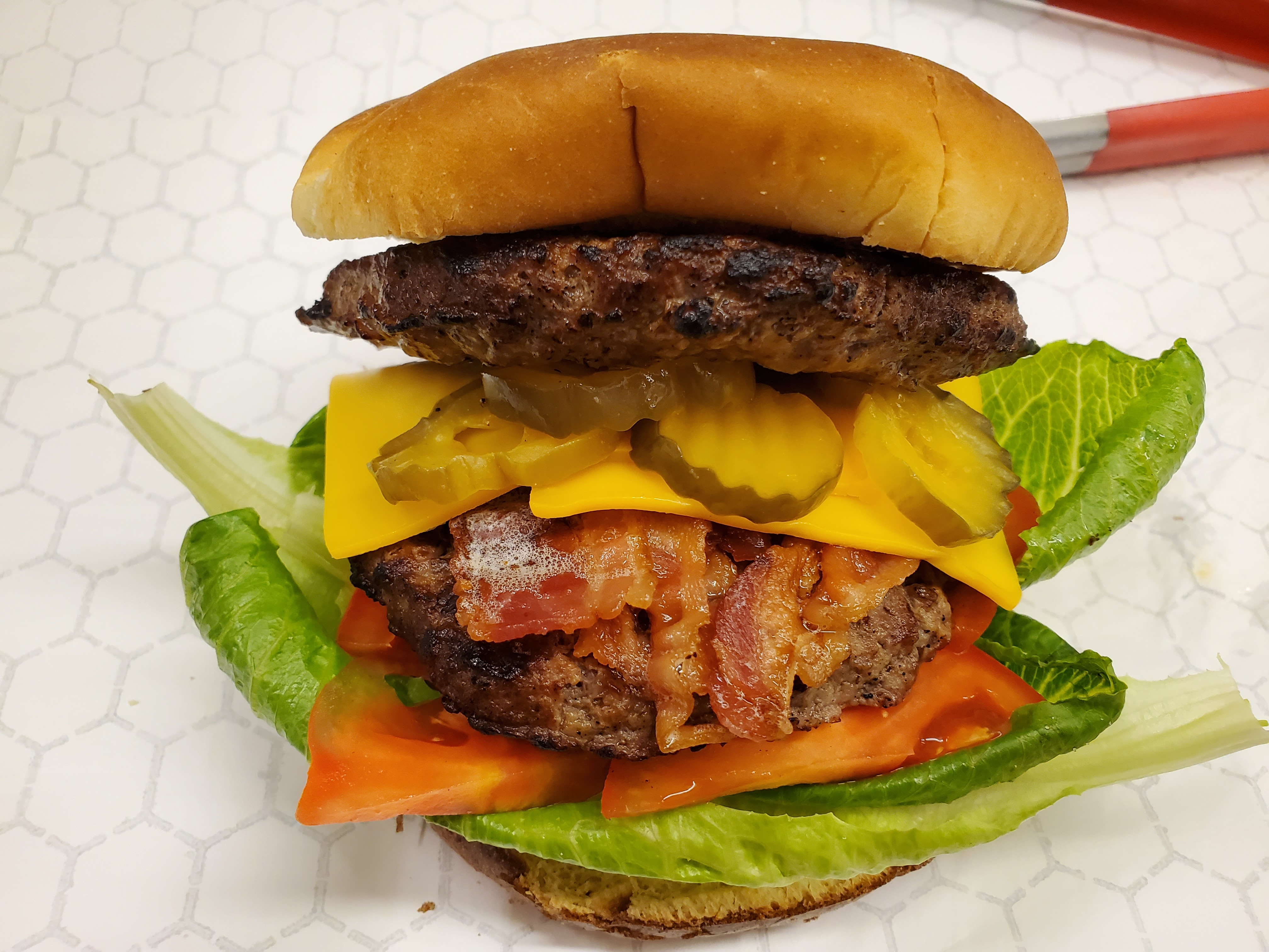 Order Double Cheeseburger (2 juicy beef patties, American melted cheese, and veggies lettuce, tomato, onion on a toasted bun) food online from Wing Depot store, Phoenix on bringmethat.com