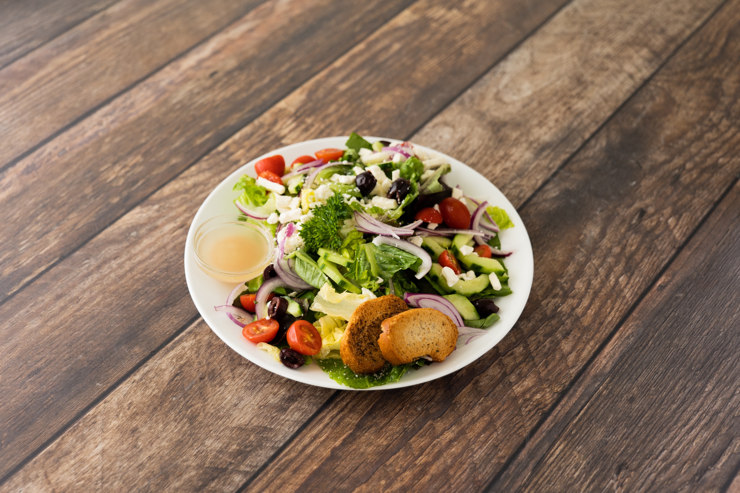Order Greek Salad food online from Cafe Brio Pizza & Deli store, Los Angeles on bringmethat.com