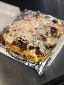 Order Nachos food online from Tacobar store, College Station on bringmethat.com