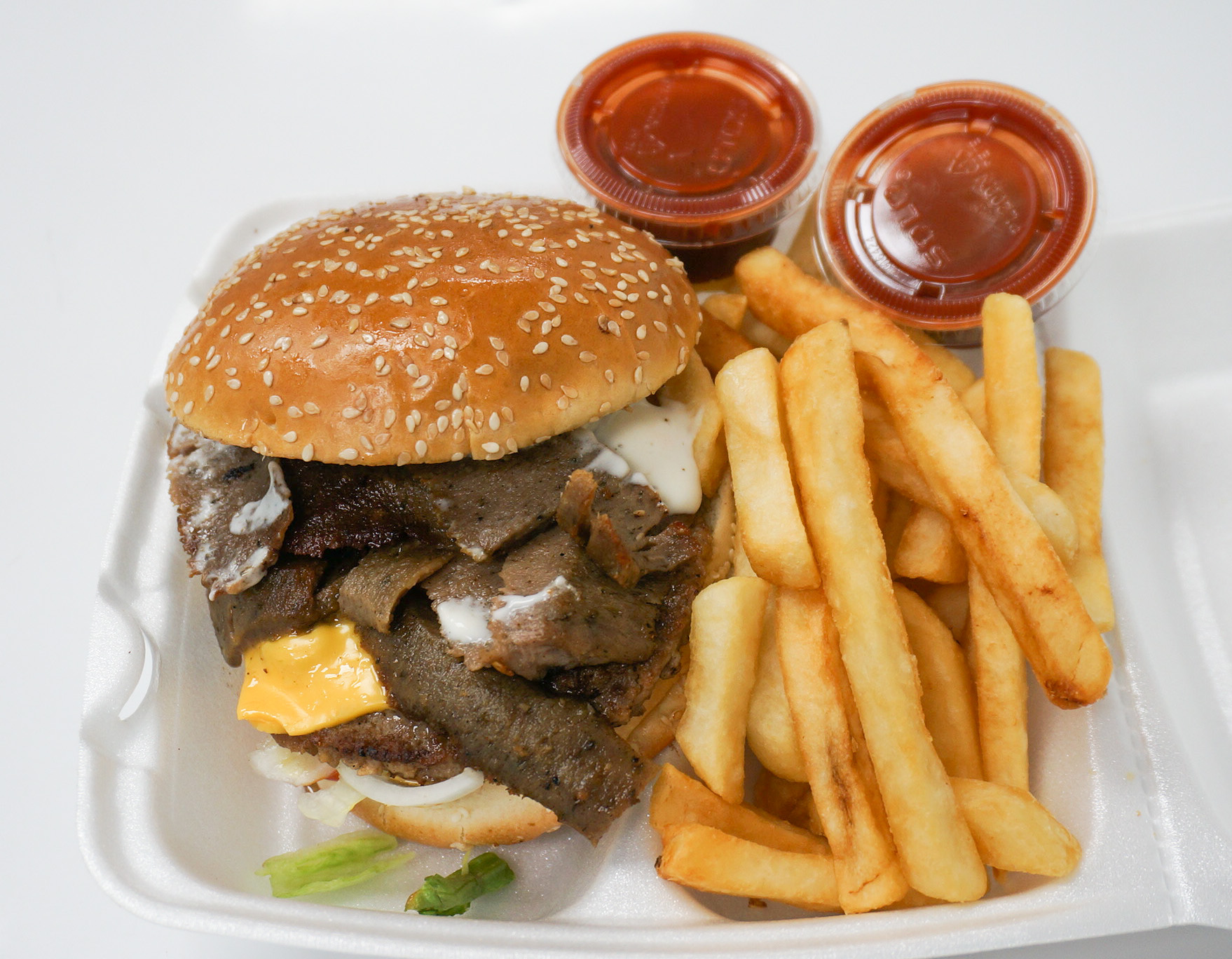 Order Gyro Cheeseburger(with Gyro Sauce) food online from Baba's Famous Steak & Lemonade store, Calumet City on bringmethat.com