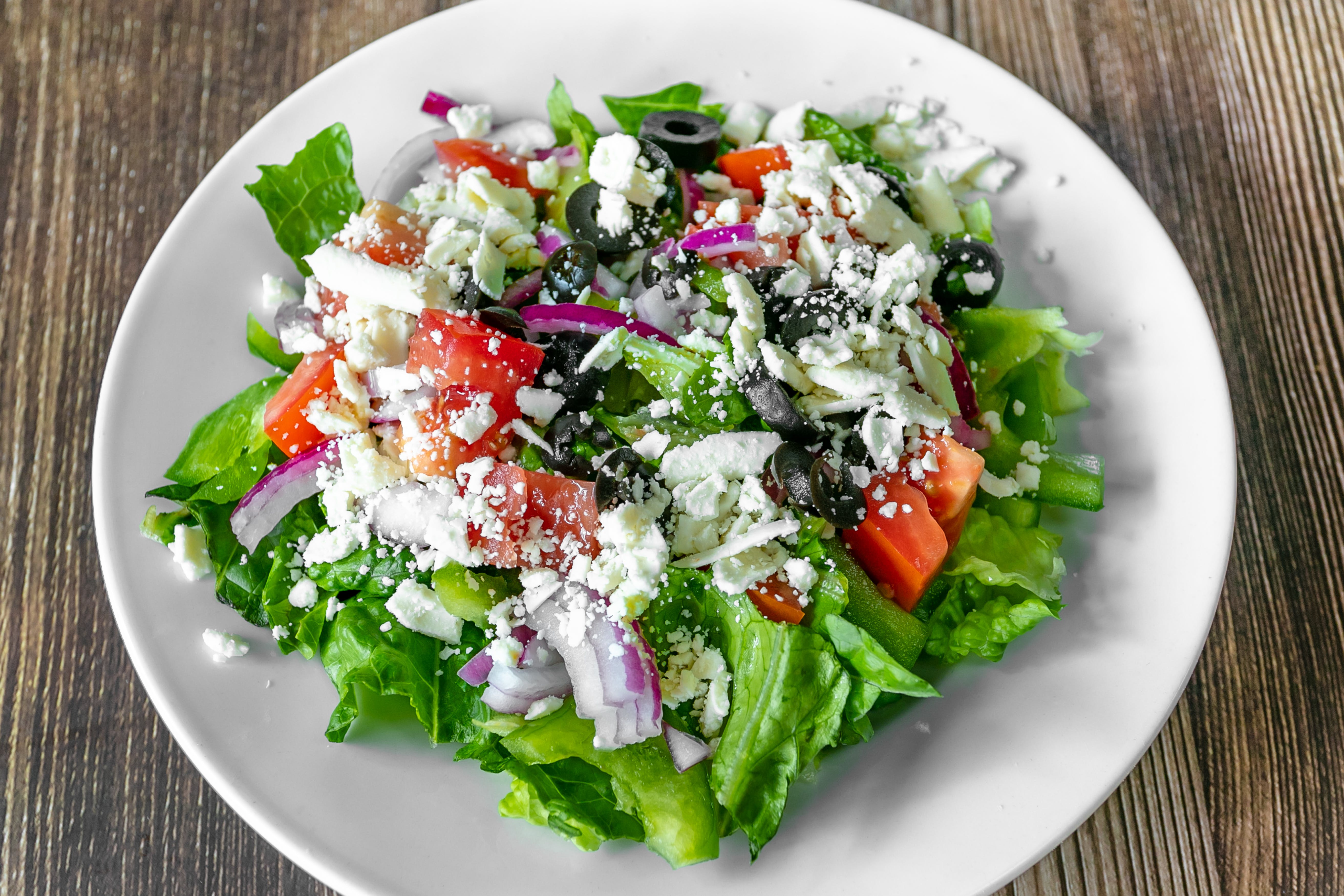 Order The Signature Greek Salad - Small food online from Bulldawgs Pizza store, Athens on bringmethat.com