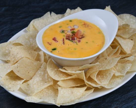 Order Chili Con Queso* food online from Rainforest Cafe store, Nashville on bringmethat.com