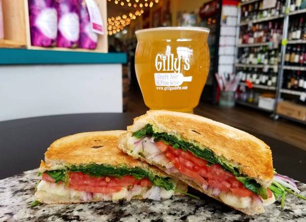 Order Tere's Toasted Tomato & Brie Sandwich food online from Gilly's Craft Beer & Fine Wine store, Rockville on bringmethat.com