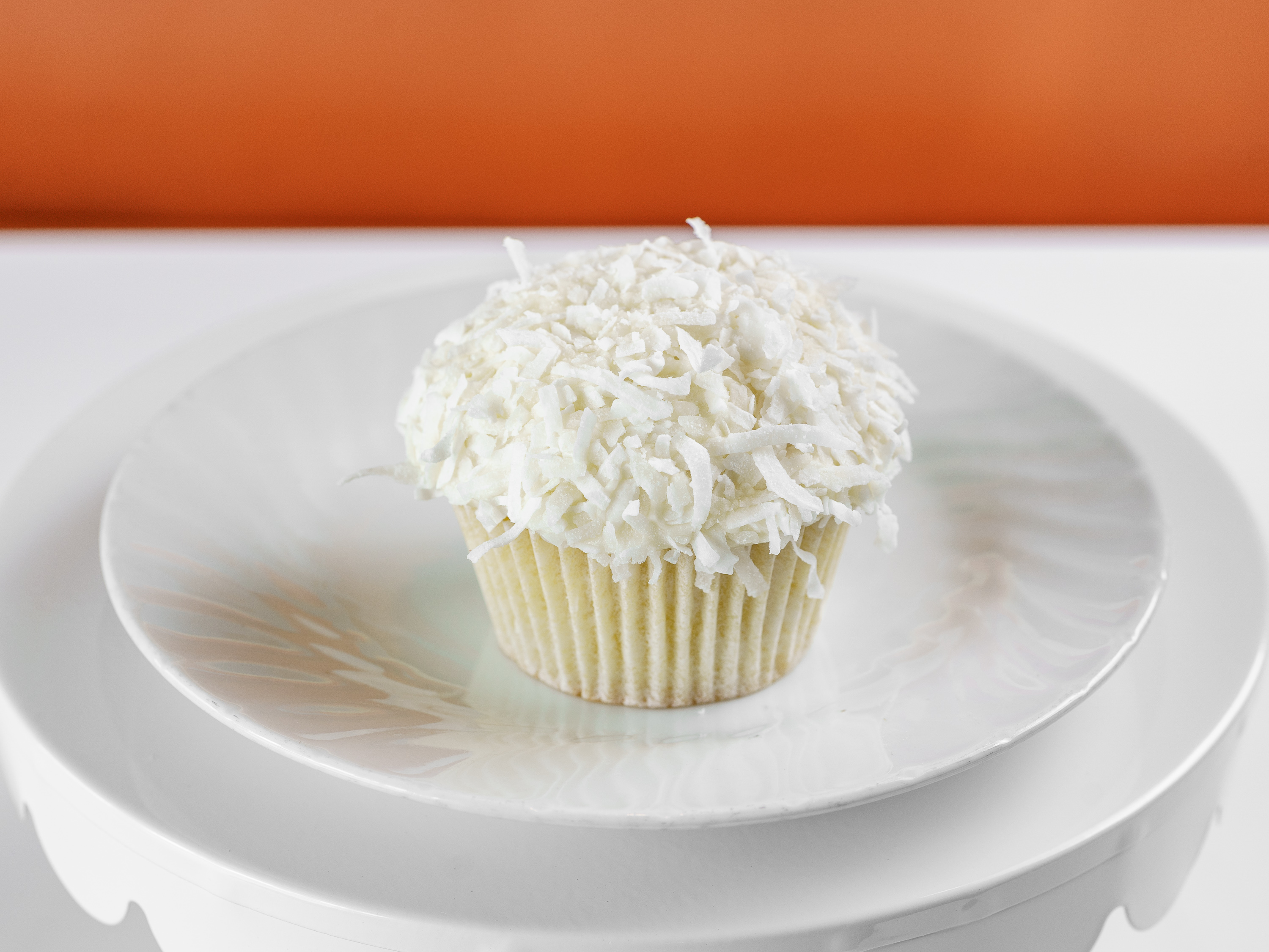 Order Royal White / Coconut Vanilla Buttercream Cupcake food online from Frosted Cupcakery store, Long Beach on bringmethat.com