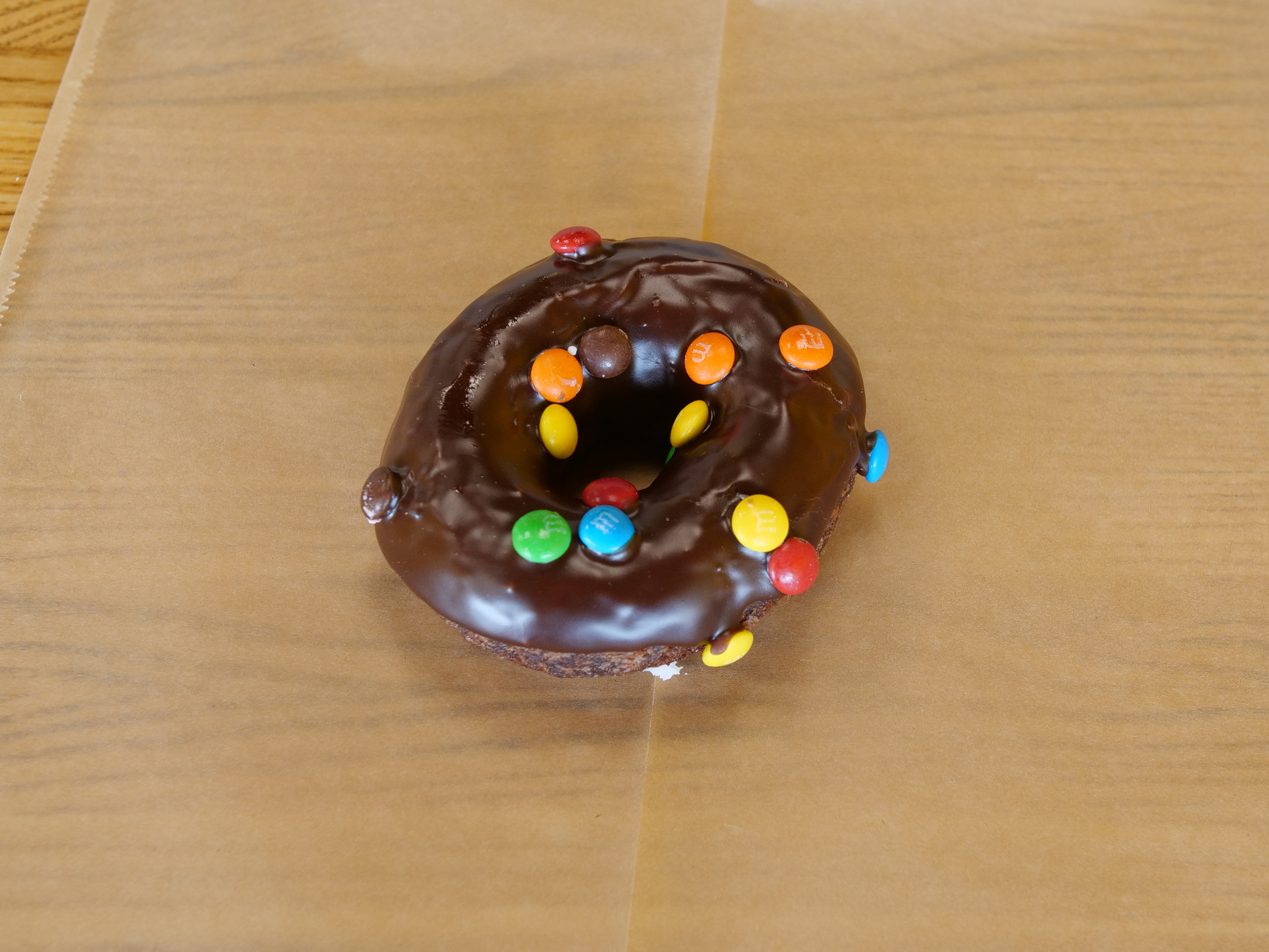 Order M&M Raised Donut food online from The Donut House store, Castle Rock on bringmethat.com