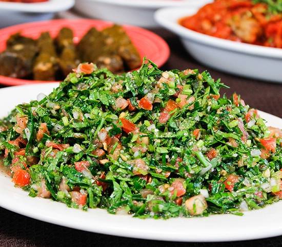 Order Tabouleh Salad food online from Sunnin Lebanese Cafe store, Los Angeles on bringmethat.com