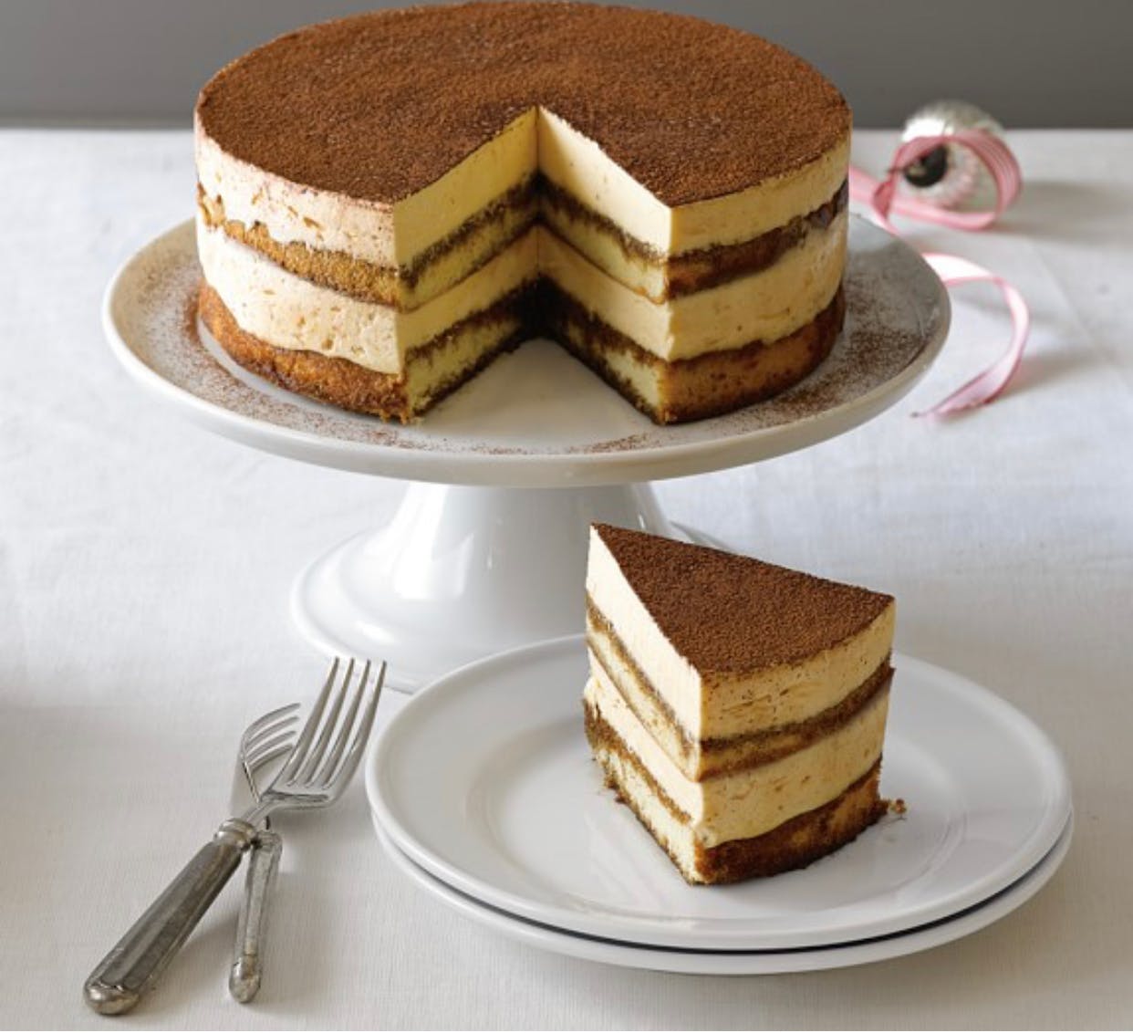 Order Tiramisu Cake - Dessert food online from Zeno Italian Grill store, Pembroke on bringmethat.com