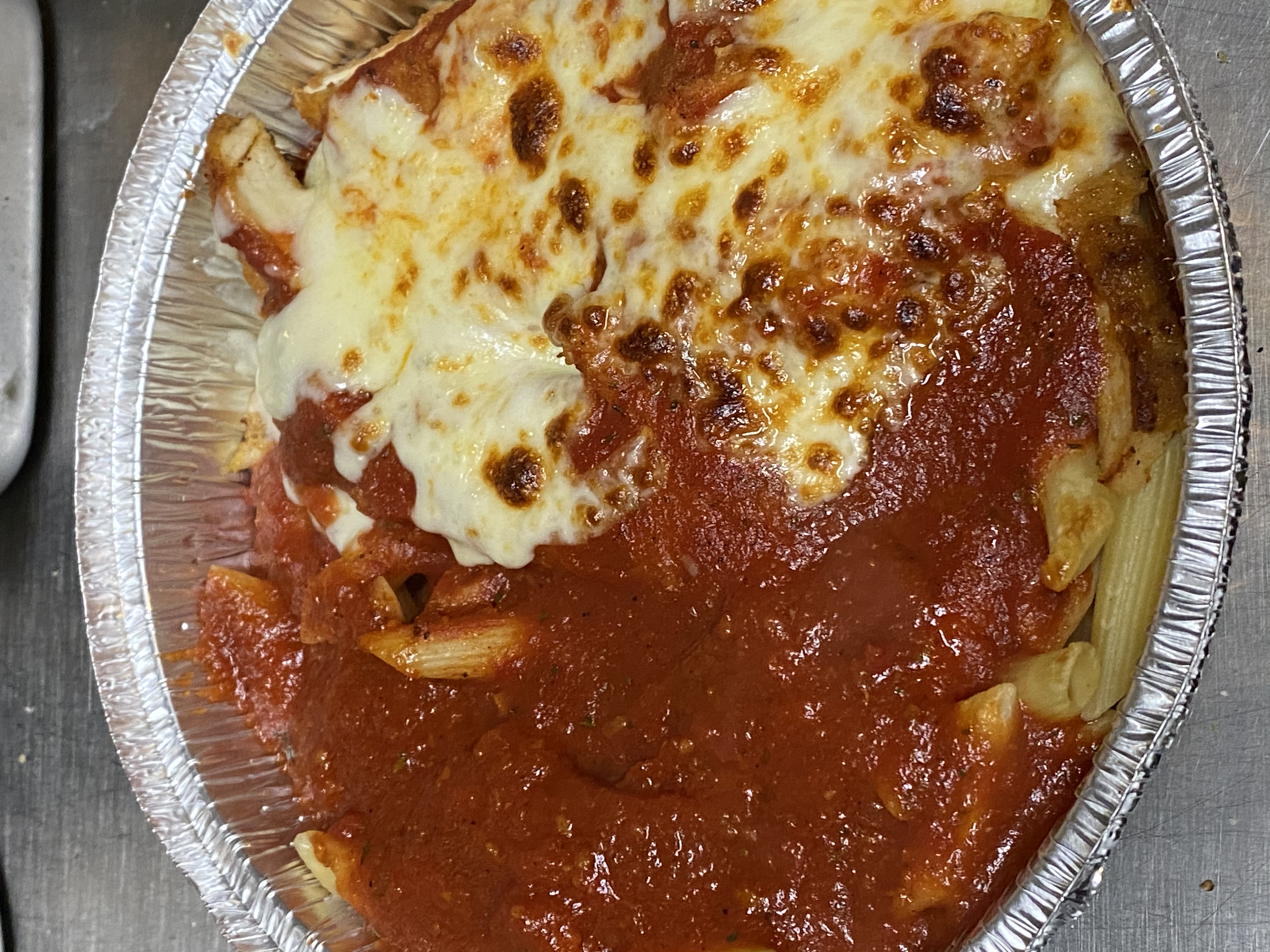 Order Chicken Cutlet Parmigiana with Spaghetti or Ziti food online from Vinny's Pizzeria store, Corona on bringmethat.com