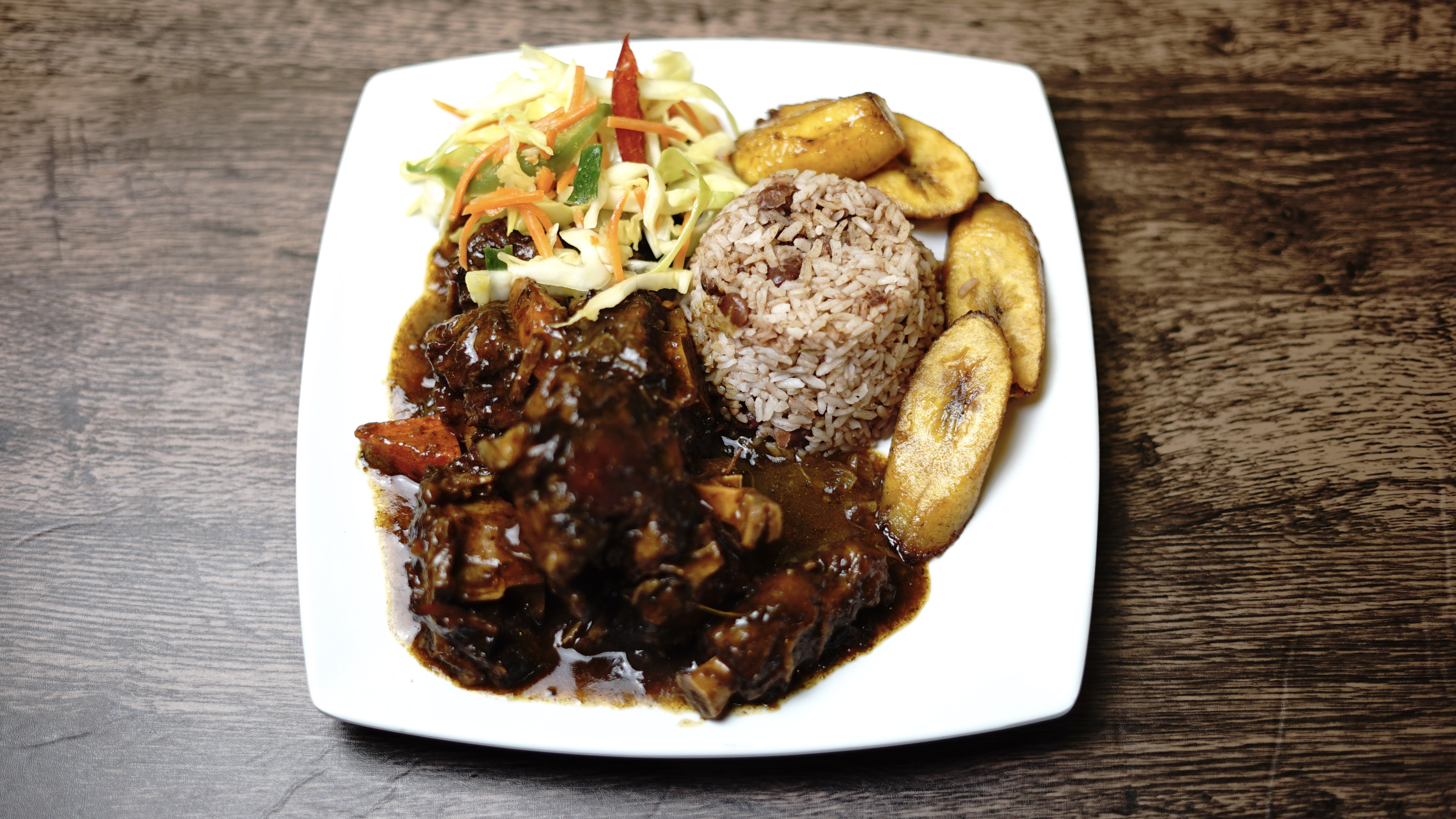 Order Oxtail a House Favorite Dinner food online from Yaad Style Jamaican Cuisine store, Portland on bringmethat.com
