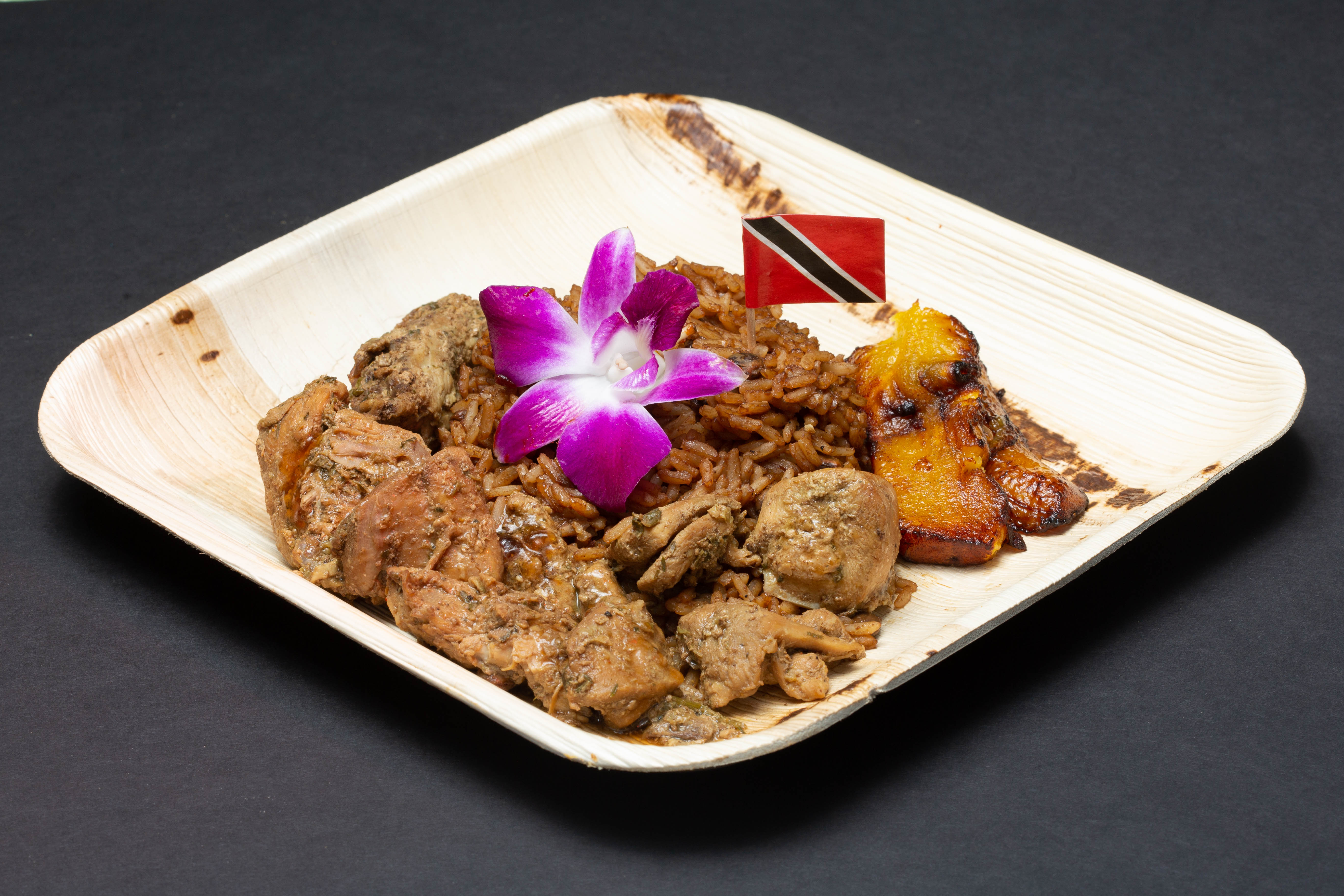 Order Calypso Brown Stew Chicken with Pelau food online from Cocobreeze store, Oakland on bringmethat.com