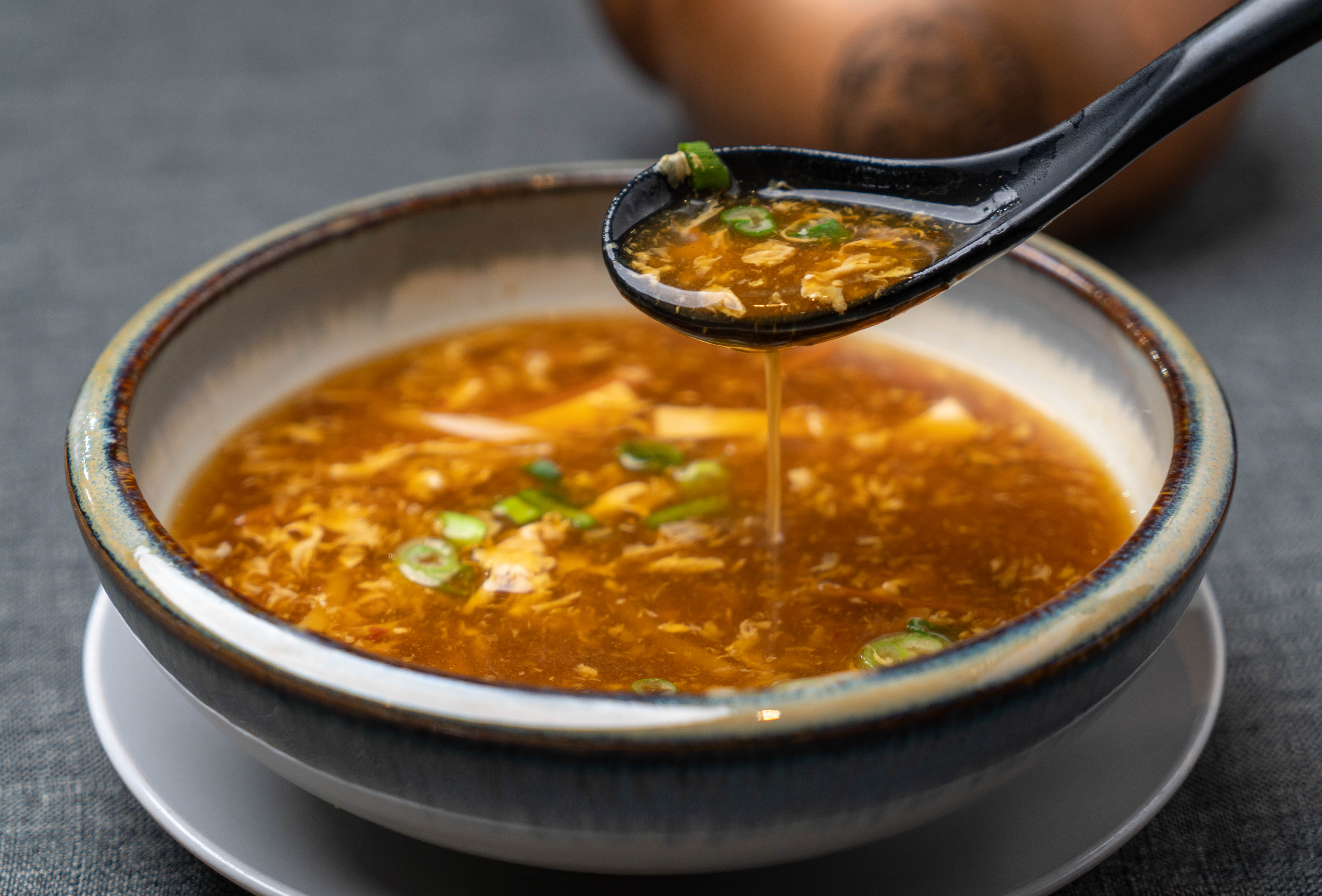 Order Hot and Sour Soup food online from Osmanthus Dim Sum Lounge store, San Francisco on bringmethat.com