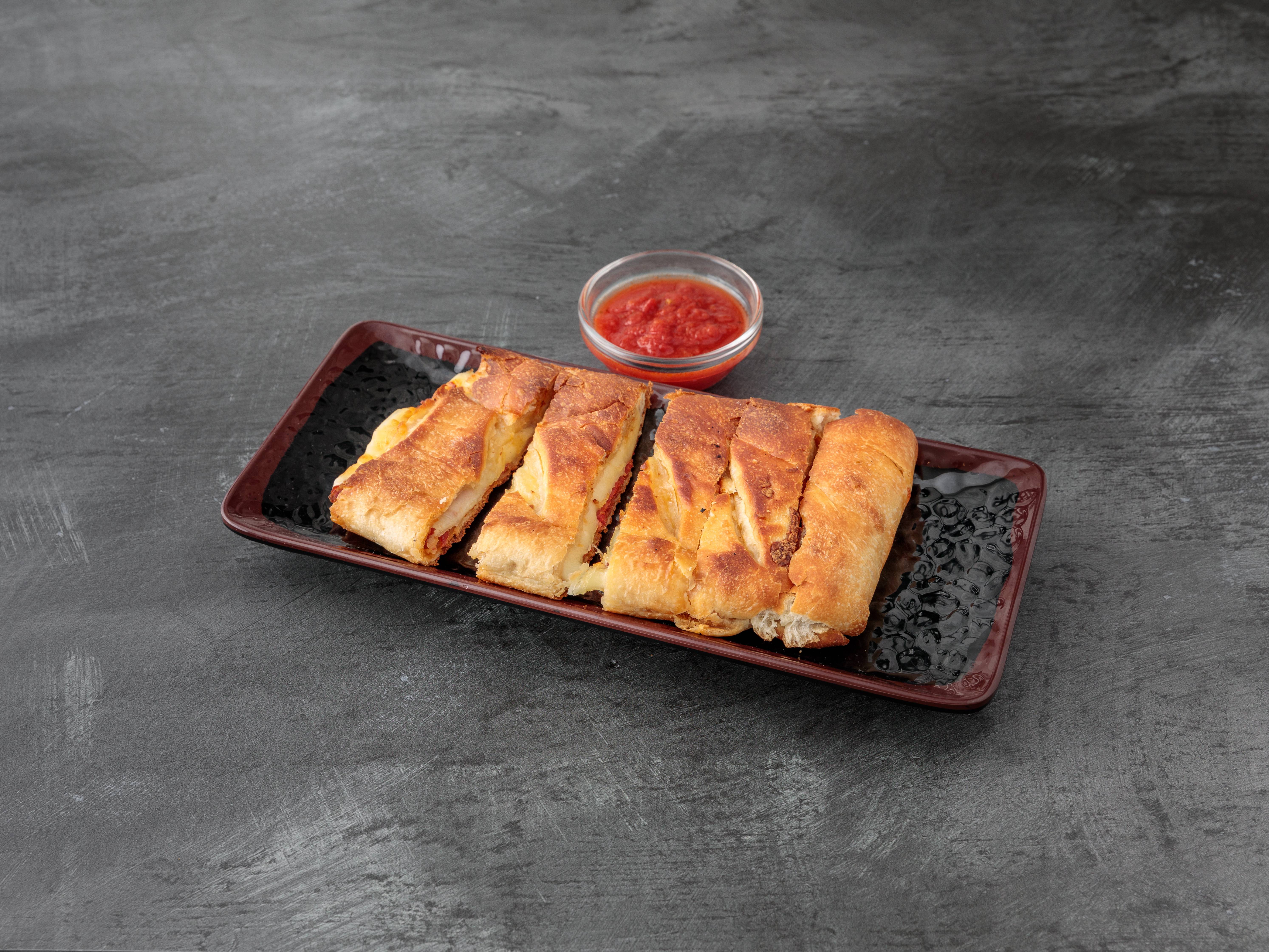 Order Pepperoni Stromboli food online from Famous Famiglia Pizza store, New York on bringmethat.com