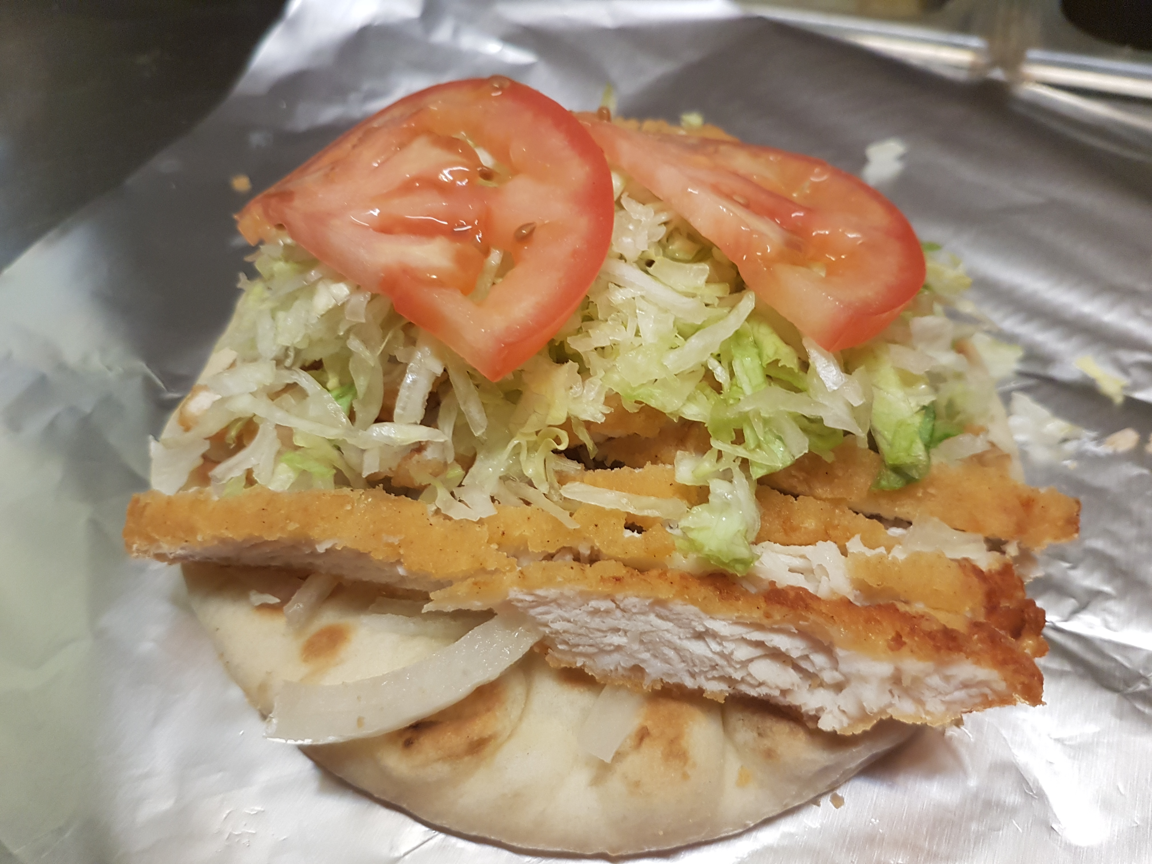 Order Crispy Chicken on a Pita food online from Breakfast Land store, Chicago on bringmethat.com