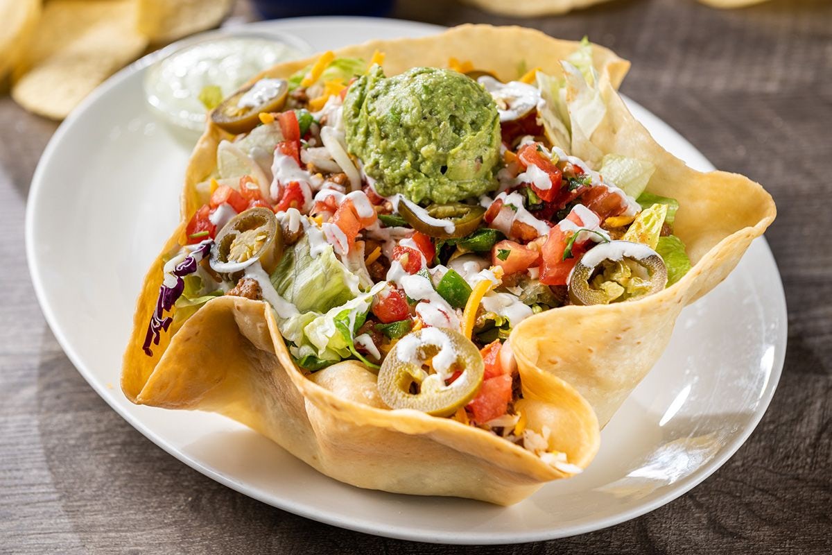 Order Grande Taco Salad food online from On The Border store, Fayetteville on bringmethat.com