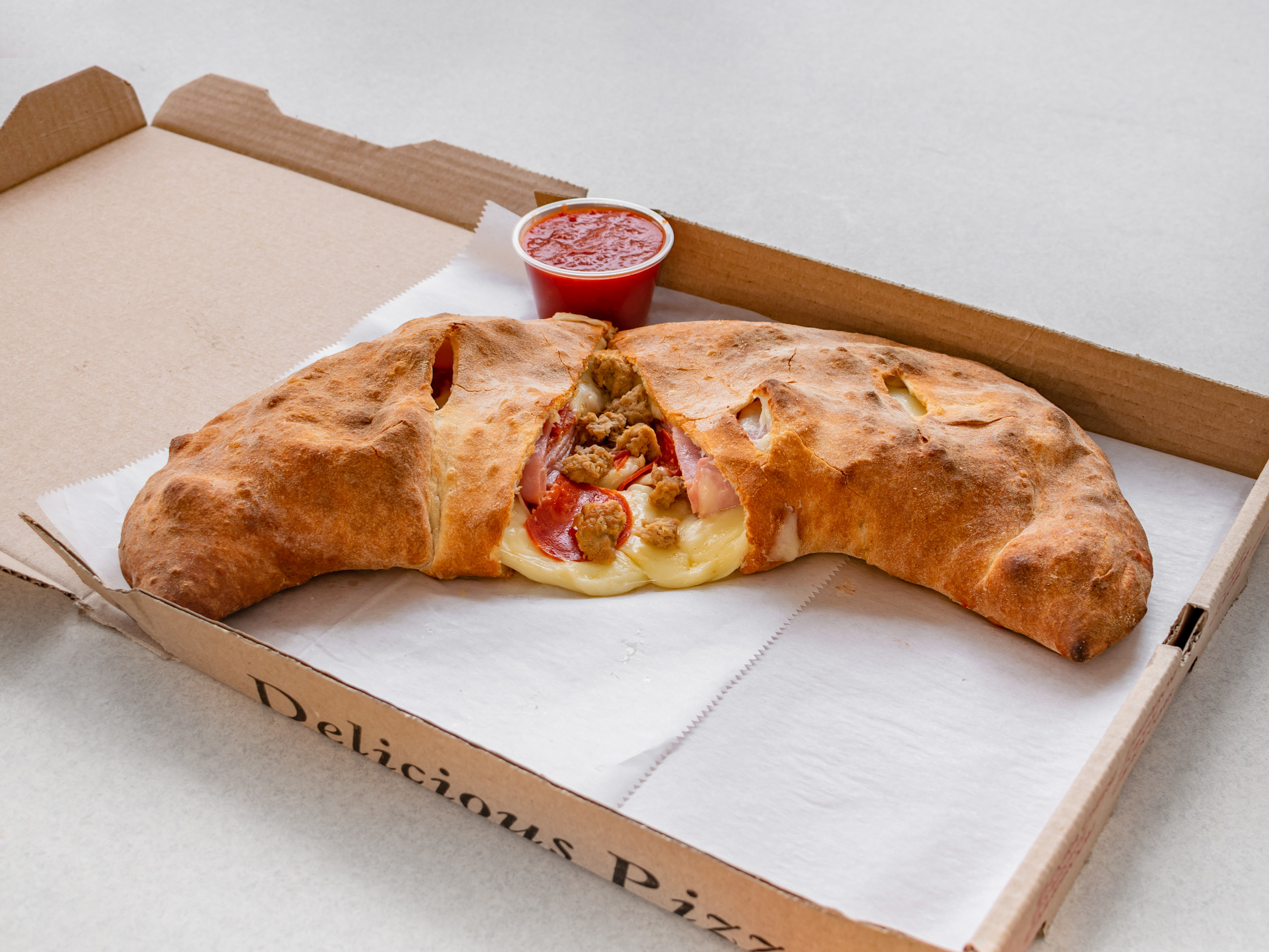 Order Meat Lovers Calzone food online from Pizza & Sandwich Express store, Little Falls on bringmethat.com