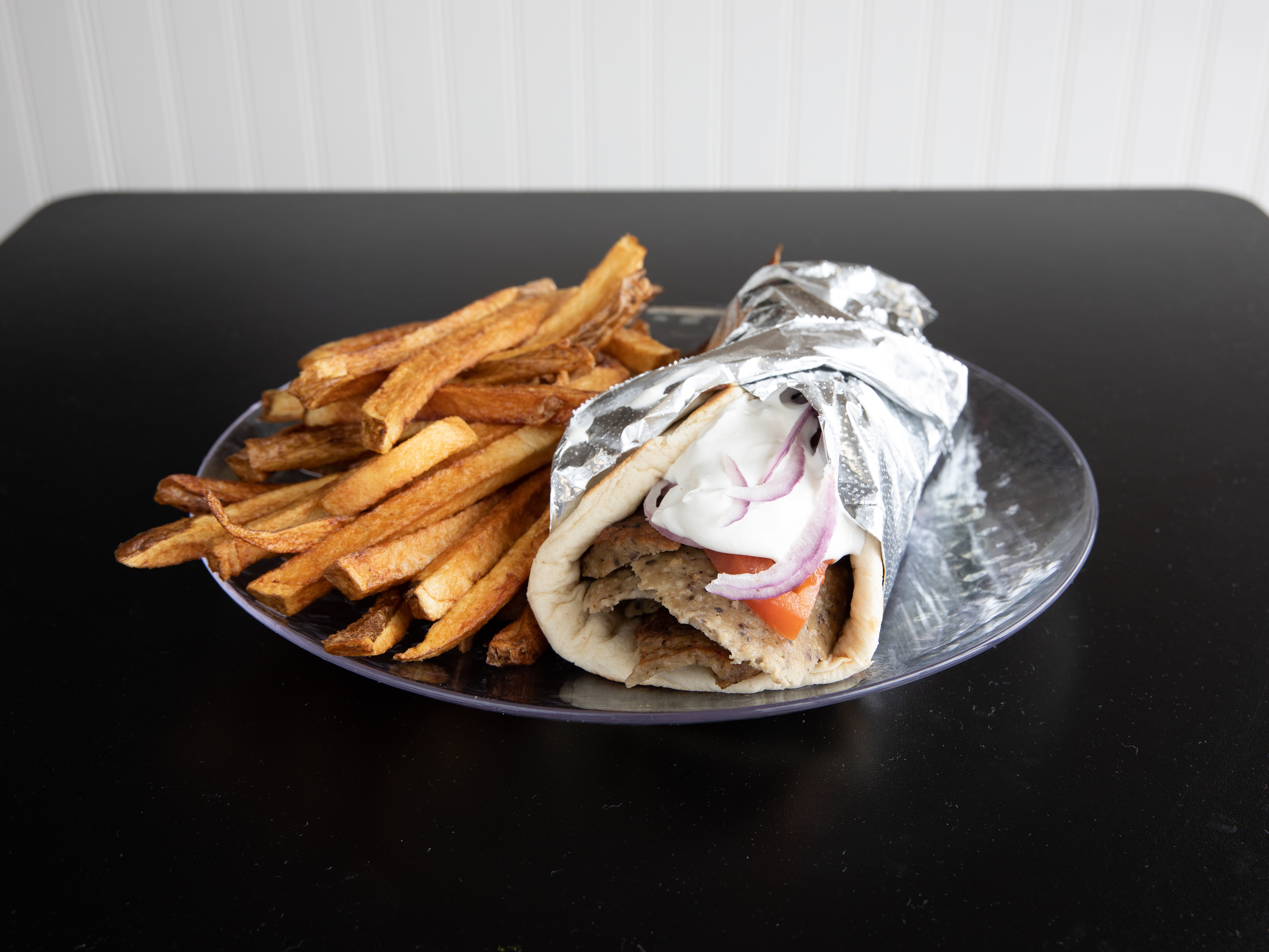 Order Traditional Gyro Sandwich food online from Uncle Nick's Greek Fried Chicken store, Austintown on bringmethat.com