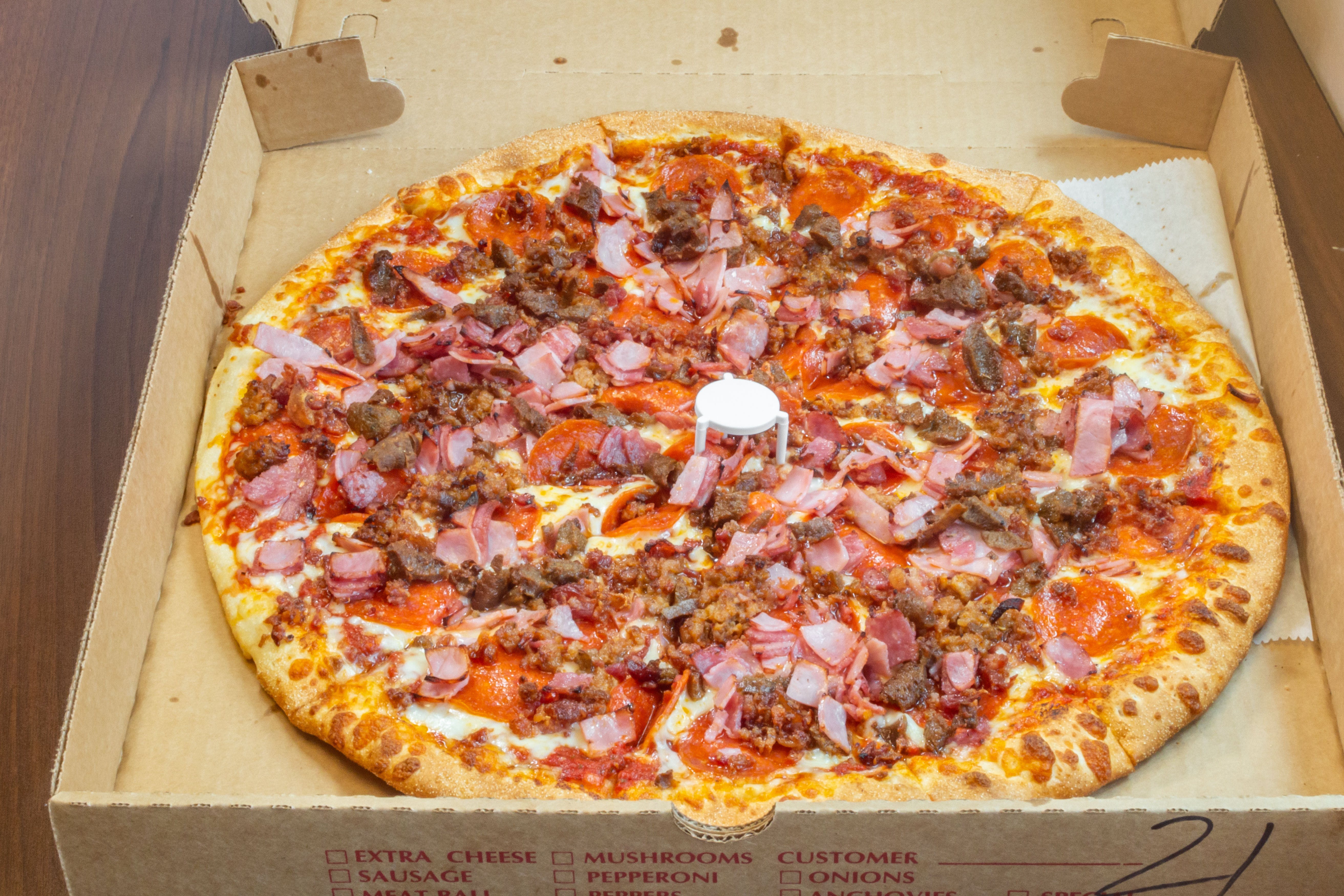 Order Ultimate Meat Pizza - Large 14" (10 Cuts) food online from Pizza On Main store, Washington on bringmethat.com