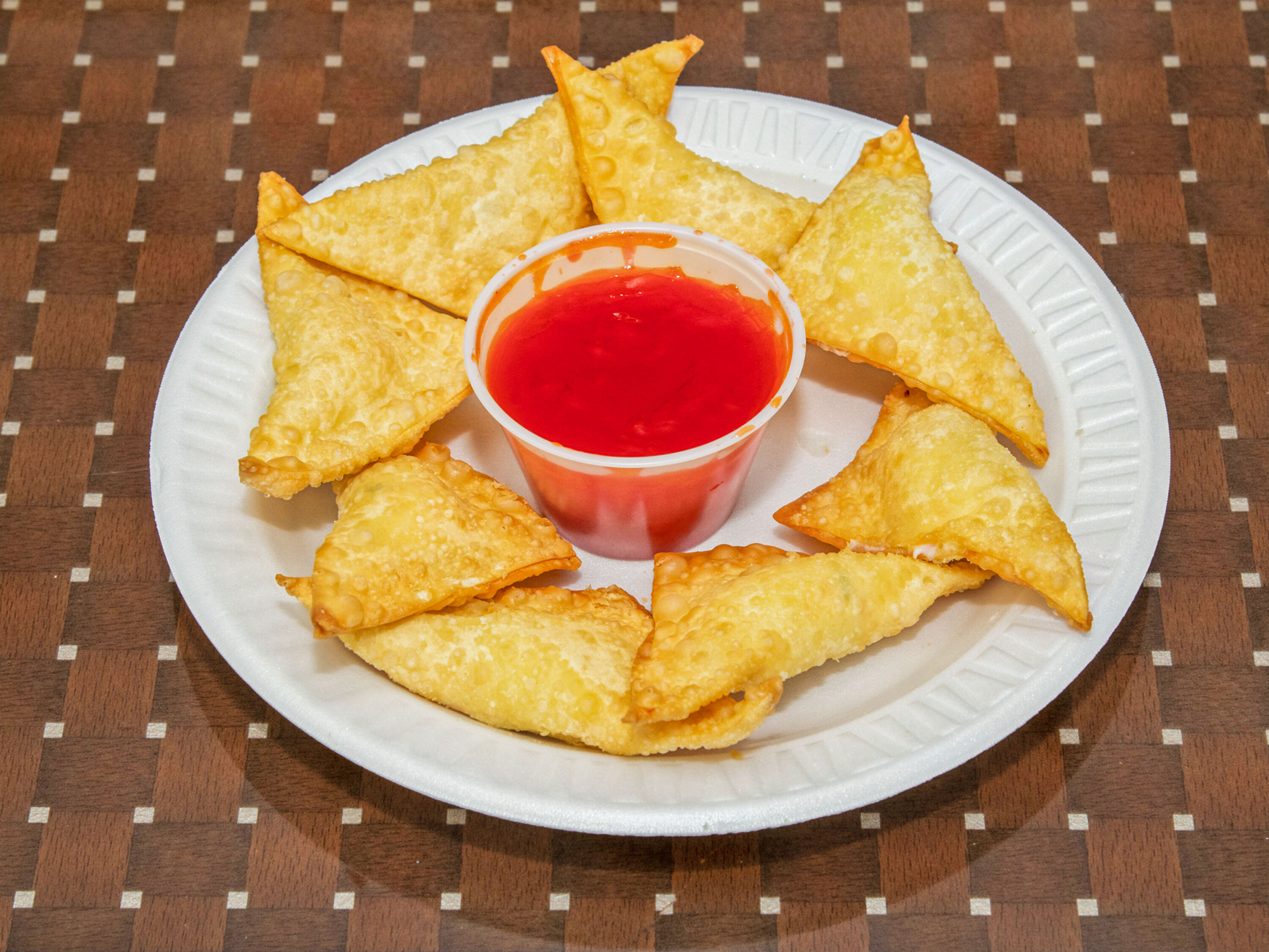 Order 8 Piece Crab Rangoon with Sauce  food online from China Garden store, Dover on bringmethat.com